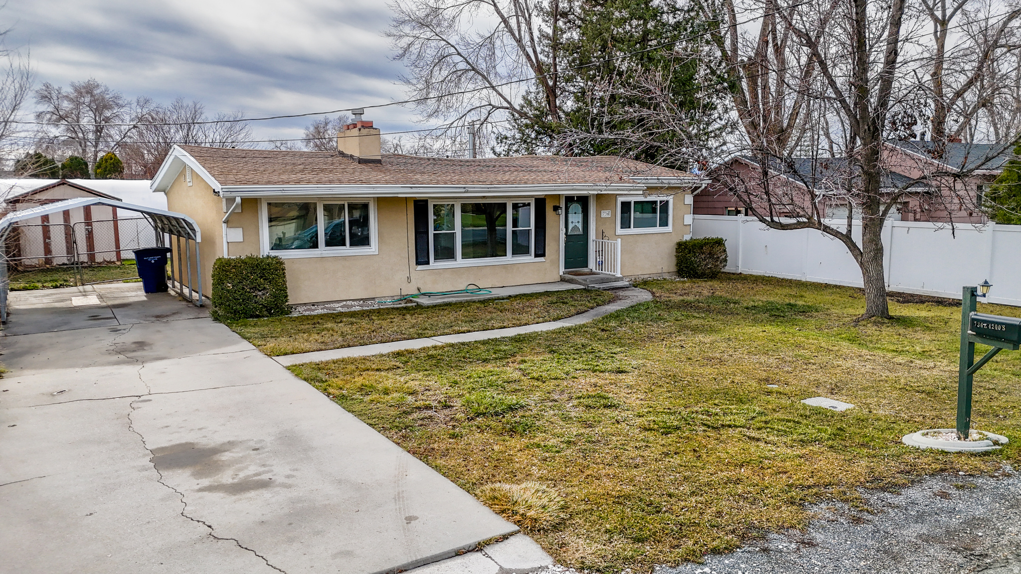 Affordable east-side living with extensive updates throughout! This move-in-ready home features new interior paint, new carpet, vinyl windows, fixtures, and an updated furnace. The remodeled kitchen shines with new cabinetry, quality appliances, and a functional layout that flows into the living space highlighted by a cozy fireplace. Enjoy outdoor living with a fully fenced backyard offering excellent privacy, a covered patio, and a firepit-perfect for entertaining. Additional features include a carport, two storage sheds, and a well-maintained yard. Conveniently located with quick freeway access and close to shopping, dining, and everyday amenities. A great opportunity to own a well-updated home on the east side at an affordable price point.