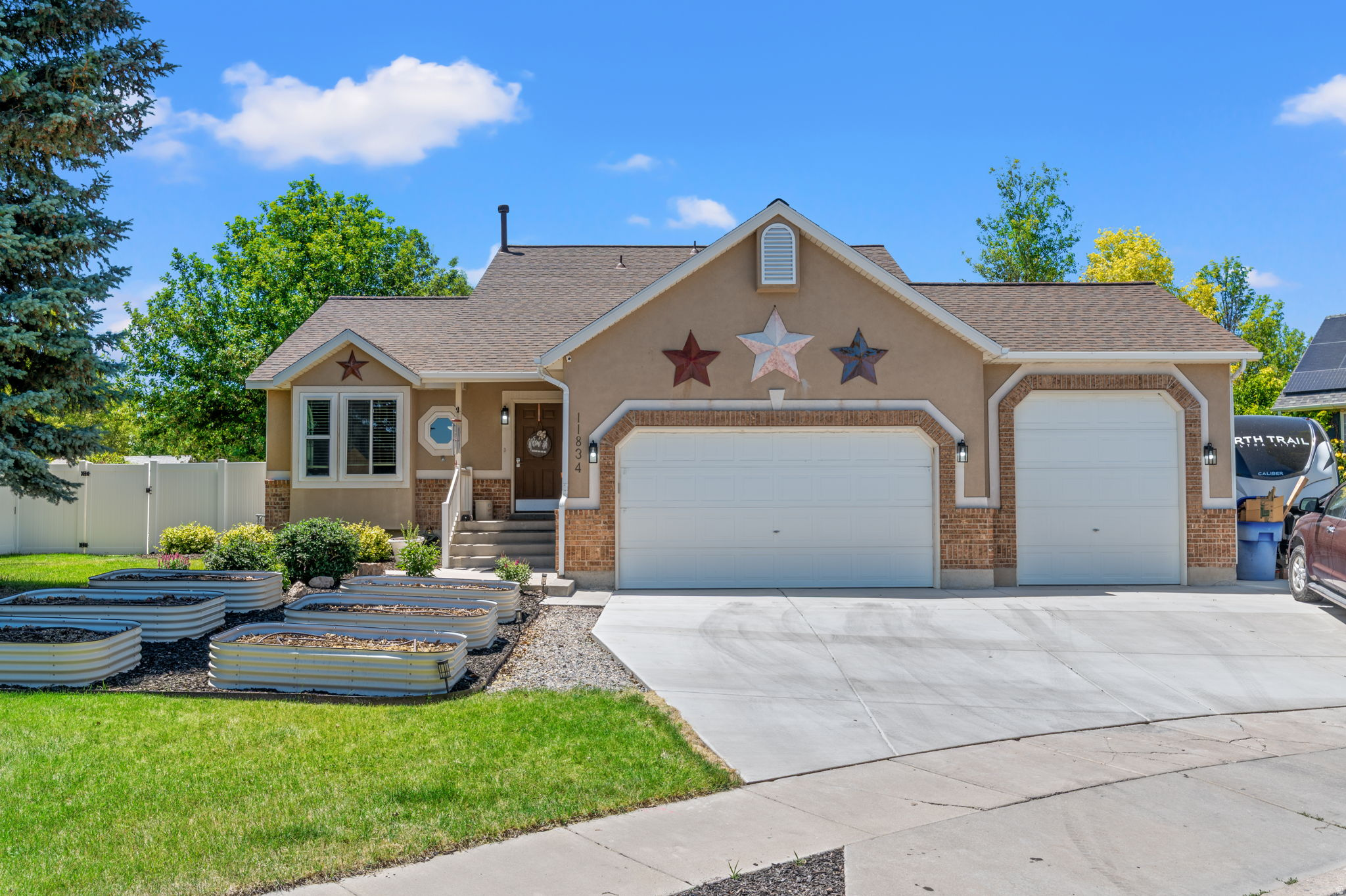 This Urban Homestead is a 2792 sq. ft., 6 bed/4 full bath home located in Copper Creek Estates has NO HOA.Throughout the many years, this home has been heavily remodeled, updated, & handcrafted from the bottom up. All improvements put into the house were done intentionally to provide the perfect homeowner experience. From the new roof, HVAC, tankless water heater, and luxury tub in the Main Bath, to the newly updated basement with garage access, this home gives you comfort, safety and reliability.   The main level showcases an updated kitchen with double ovens and granite countertops and a formal living room to start. The master bedroom & bathroom, found on the second story, provides a large beautiful space, along with a relaxing luxury jetted tub, and walk-in closet. Designed with convenience in mind, the home includes 32" wide doorways and laundry on the ground floor. New carpet has been installed throughout the entirety of the home.  85' perfectly mounted TV included in the purchase!   The sellers built raised garden beds with a drip irrigation system in the front of the property to take full advantage of the sunlight throughout the day. Beautiful strawberry and rhubarb patch in the back yard. You can find an are of yard cleared and ready for up to 6 chickens on the lot. Enjoy family & friend gatherings on the custom built deck, perfect for intimate gatherings of all kinds. Four mature fruit trees line the backyard fence. The Basement features 3 bedrooms, an office, full bath and is plumbed for a kitchen. Garage access makes it perfect for rental or AirBNB customers. New driveway, three car garage and RV pad assure that you don't run out of storage space. The garage features built-in, super durable shelving allowing for expansive storage. If you are looking for great schools, no HOA, and proximity to Costco, check this home out.  Schedule a tour today!    Disclaimer: Square footage figures are provided as courtesy estimates only and were obtained from county records. Buyer is advised to obtain an independent measurement.