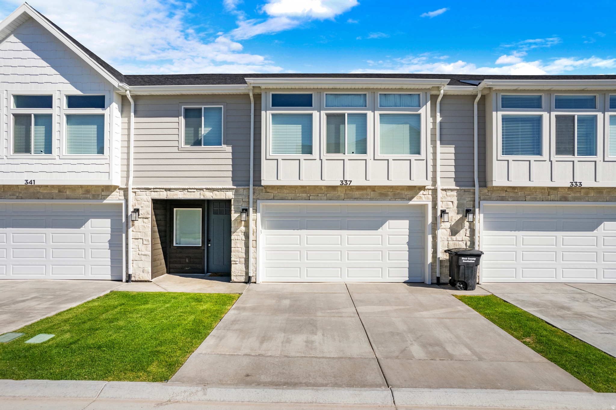 Unit #26. Welcome to your BRAND NEW short term rental approved lakeside sanctuary in the heart of Garden City! This beautifully appointed townhome offers the perfect blend of comfort, style, and natural beauty. Step inside to discover an inviting living space flooded with natural light. The kitchen includes modern quartz countertops, stainless steel appliances, and a walk-in pantry. Upstairs you will find 3 large bedrooms, 2 bathrooms and a second gathering/loft area. With endless opportunities for outdoor adventure right at your doorstep, including boating, hiking, and fishing, this is truly a haven for nature lovers and outdoor enthusiasts to enjoy year round. Don't miss out on the opportunity to call this piece of paradise your own. Schedule a showing today and start living the lakeside lifestyle you've always dreamed of!