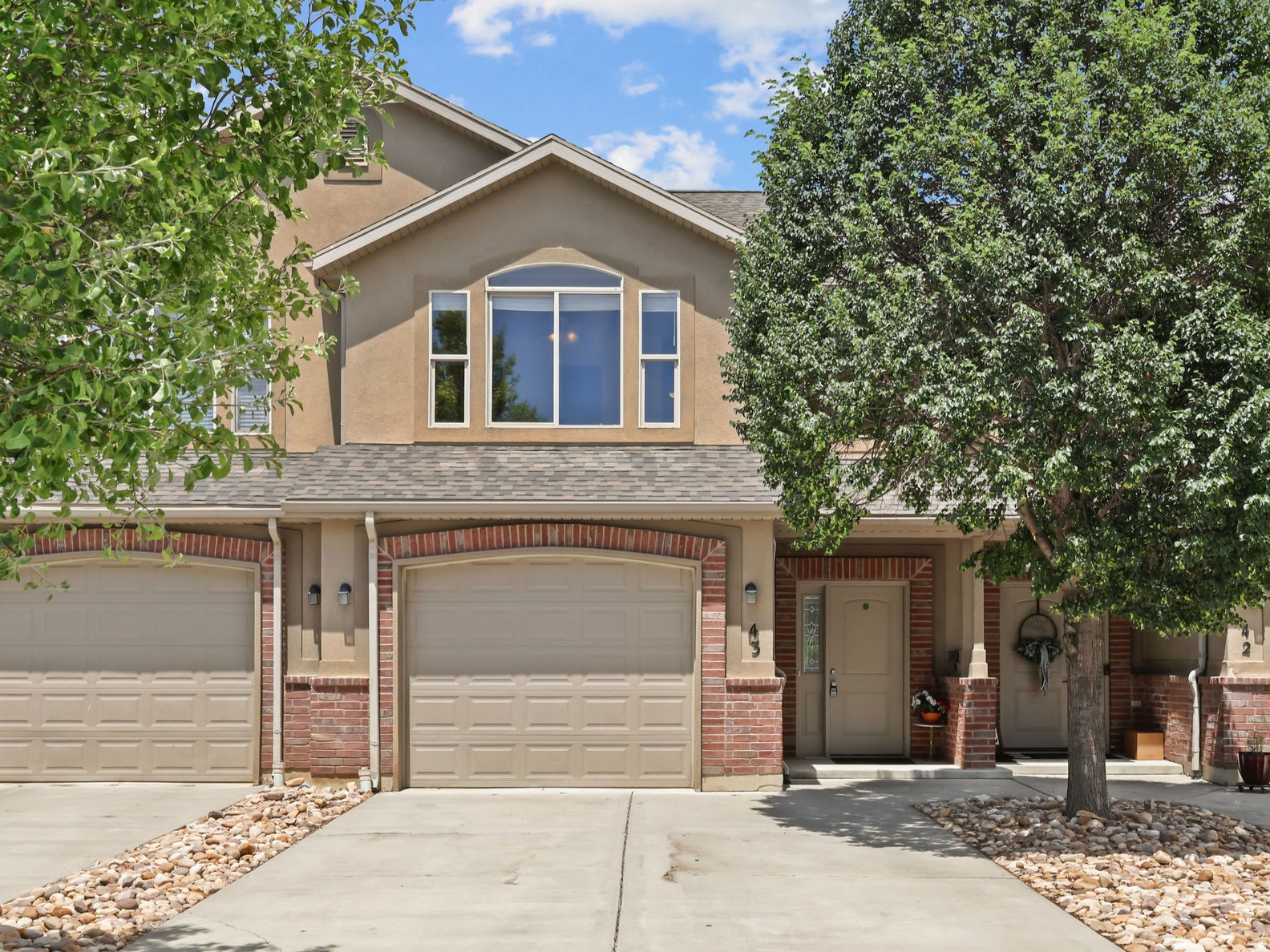 Enjoy the convenience of townhome living with the feel of a private residence. A long, private driveway provides extensive off-street parking and gives an immediate sense of space. Inside, large windows frame stunning mountain views from nearly every room, flooding the home with natural light.  Outside, mature trees provide beautiful shade that keeps the interior cool during the summer. The combination of generous spacing between neighbors, a large backyard, and a relaxing patio creates a quiet, private retreat.  Dedicated guest parking and RV rental space available on site.  If you want the space of a traditional home without the typical townhome crowding, this is the one for you.  Easy to show-come see it today! If you can't make it in person, click the tour button to take the virtual 3D tour right now.