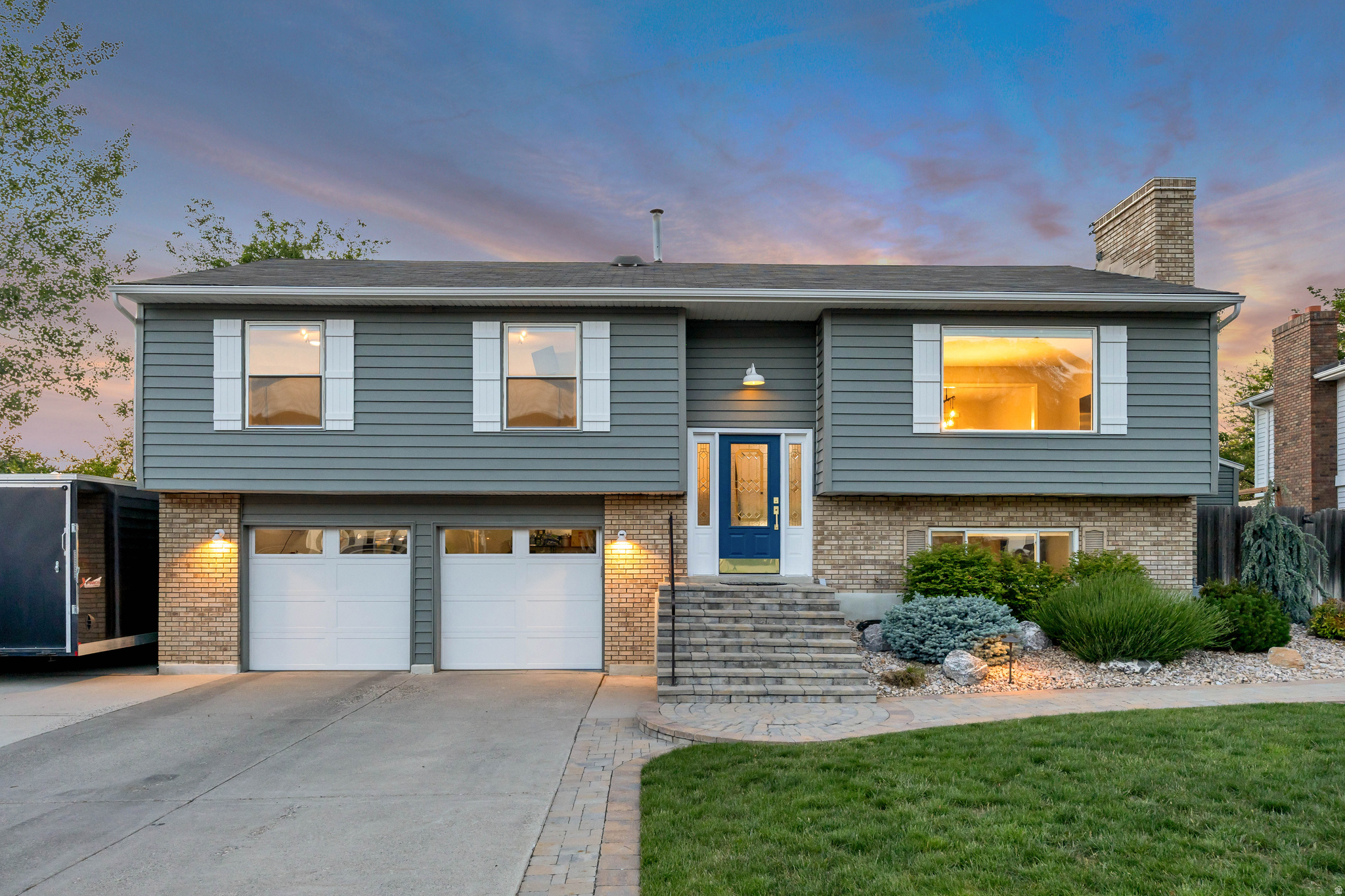 Beautifully updated home with incredible mountain and valley views! This home has been recently renovated inside and out with new flooring, cabinetry, and paint throughout. The kitchen and bathrooms feature granite and marble countertops, soft-close hardware, and recently installed Frigidaire appliances including the range, refrigerator, dishwasher, and microwave. Enjoy the cedar-lined primary closet, which also has the flexibility to function as a bedroom. Step outside to a professionally landscaped yard featuring a Trex deck, automatic sprinkler and drip irrigation systems, garden boxes, landscape lighting, hot tub, sunken gas fireplace, and a soothing water feature. Additional upgrades include new Weather Guard insulated siding and insulated garage doors with new openers. Ideally located near the base of Little Cottonwood Canyon with world-class skiing and hiking just minutes away, plus convenient access to parks, schools, shopping, and freeways. Call today to schedule your appointment!