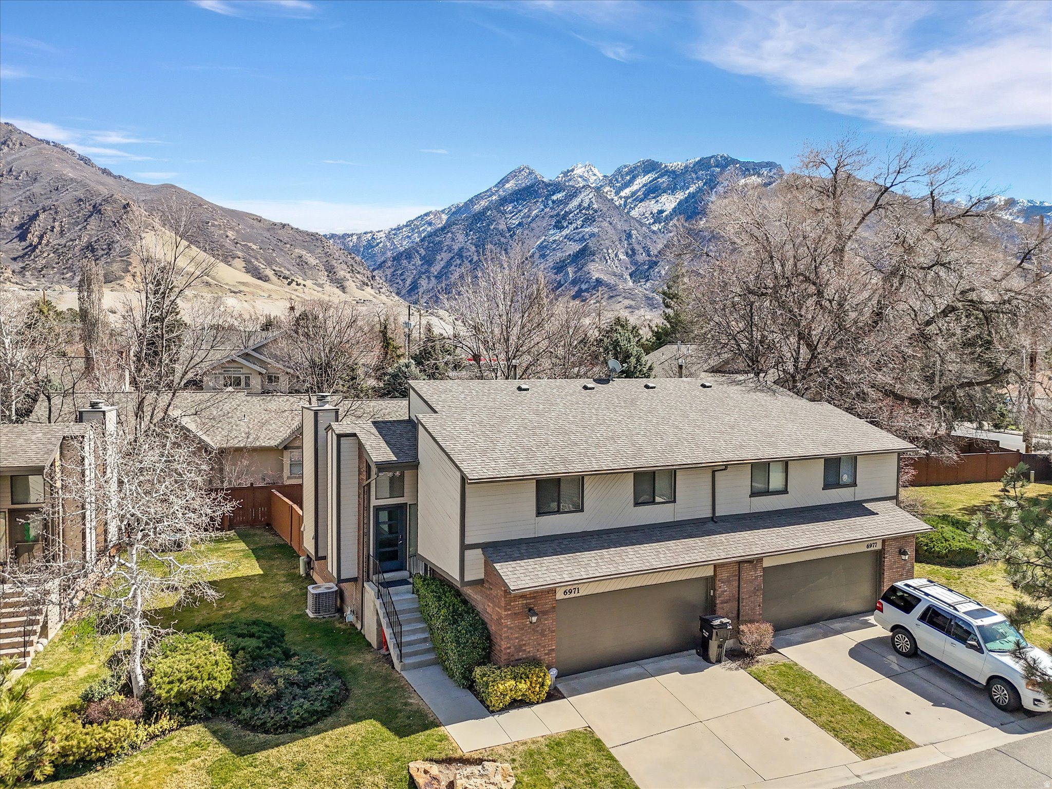 Back on the market! Buyer lost his job just before closing. Rarely available row-end townhome in pristine condition in sought-after Cottonwood Heights! Nestled on a quiet cul-de-sac, this 3-bedroom, 2-bath home offers a spacious three-level layout with two family rooms, vaulted ceilings, and a cozy gas fireplace. The 2-car garage features built-in storage, perfect for all your gear. Enjoy a private, fully fenced backyard with a large deck and stunning Wasatch Mountain views-ideal for relaxing or entertaining. Just minutes from Big and Little Cottonwood Canyons, I-215, shopping, dining, and world-class recreation. Priced well below appraisal. HOA prohibits short-term rentals. A rare find-schedule your private tour today!