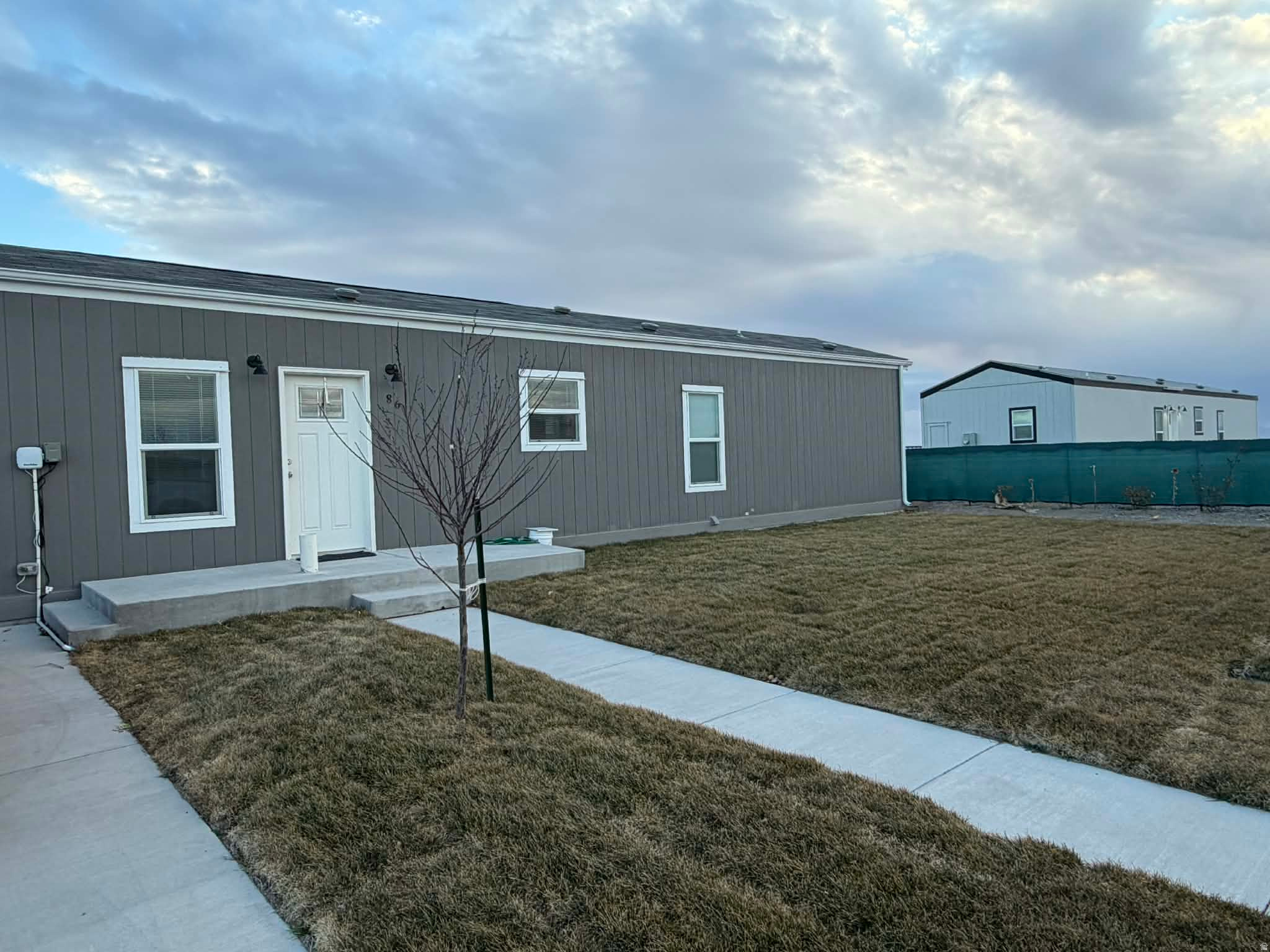 Enjoy peaceful country living in this 3-bedroom, 2-bath home built in 2023, featuring unobstructed views of open farm ground to the south and wide-open skies. This nearly new home is move-in ready with thoughtful upgrades already completed, including rain gutters, new sod, a full sprinkler system, fruit trees, fencing, and a Tuff Shed for extra storage. Relax and take in the quiet surroundings that Hinckley has to offer