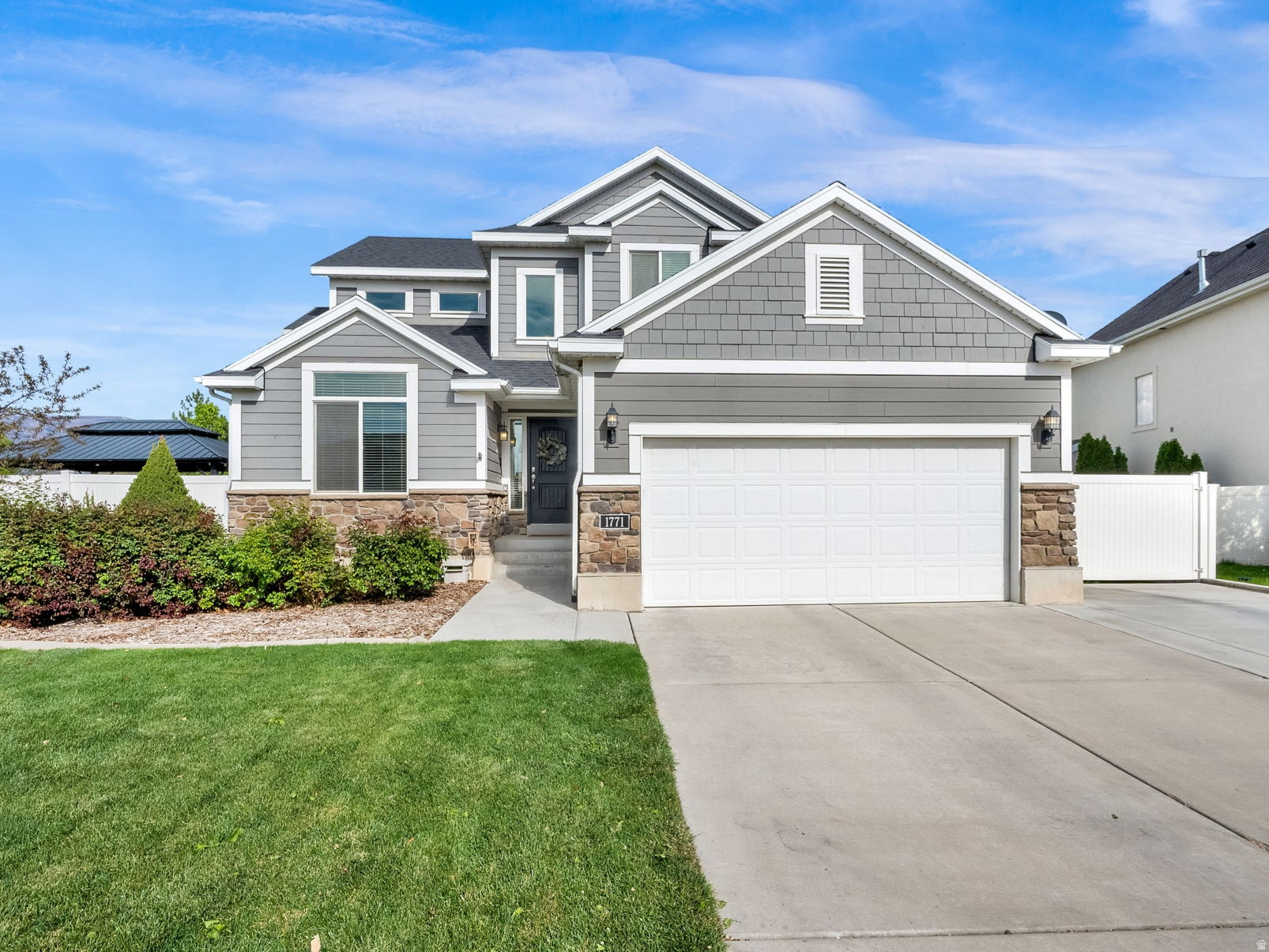 Imagine stepping through the front door into a grand, light-filled entry where natural light carries from front to back and the home immediately feels open, warm, and inviting. The main level is designed for everyday comfort and easy gathering, with soaring ceilings, warm wood flooring, and an effortless flow into the kitchen, dining, and living spaces. This home checks all the boxes! Picture mornings in the bright white kitchen, evenings gathered around the dining table, and cozy nights relaxing on the sofa in the spacious family room. The finished basement gives you even more room to live - movie nights, workouts, game days, guests, Mother In Law Apartment or a simply quiet place to unwind. At the end of the day, escape to the primary suite with vaulted ceilings, a beautiful accent wall, dual vanities, soaking tub, and walk-in shower. Outside, enjoy a fully fenced backyard made for entertaining with a patio, fire pit area, covered hot tub space, and a yard big enough to play catch in! Set on a cul-de-sac in an excellent neighborhood, just walking distance to the community pool, three parks, legacy trail and Odyssey Elementary - this is the kind of home where comfort, connection, and lifestyle all come together.