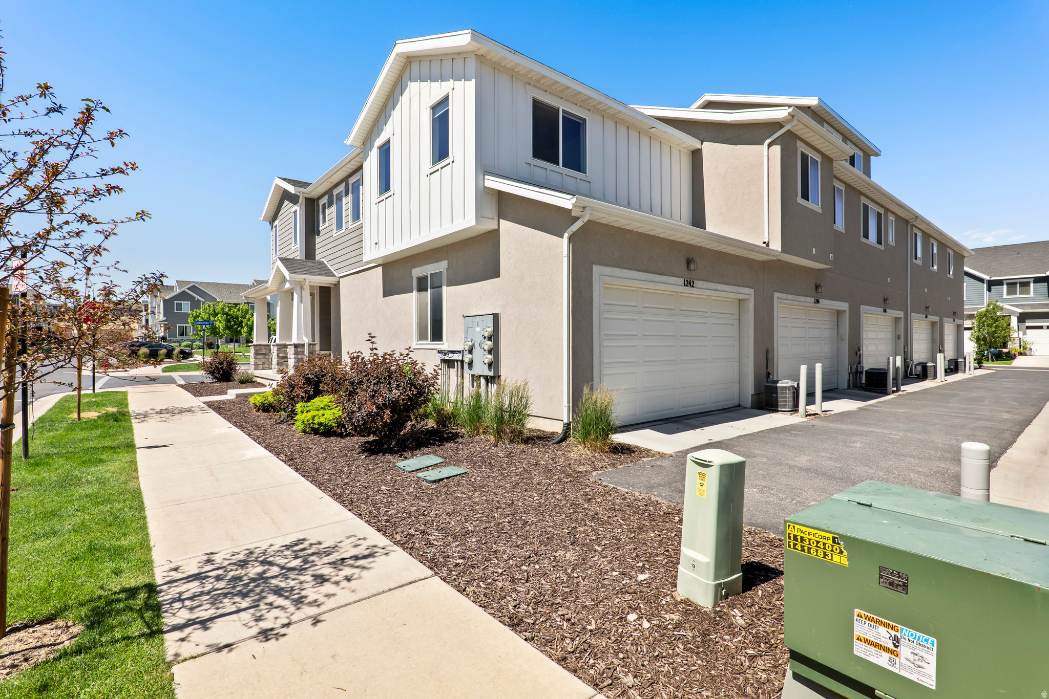 One of the most desirable locations in the community! This light filled corner end unit overlooks playgrounds, schools, and mountain views while offering added privacy with only one shared wall. Large 2 car garage, washer, dryer, refrigerator included! Move-in ready with room to grow in the unfinished basement. See it today! Square footage figures are provided as a courtesy estimate only and were obtained from county records .  Buyer is advised to obtain an independent measurement. Seller related to Agent.