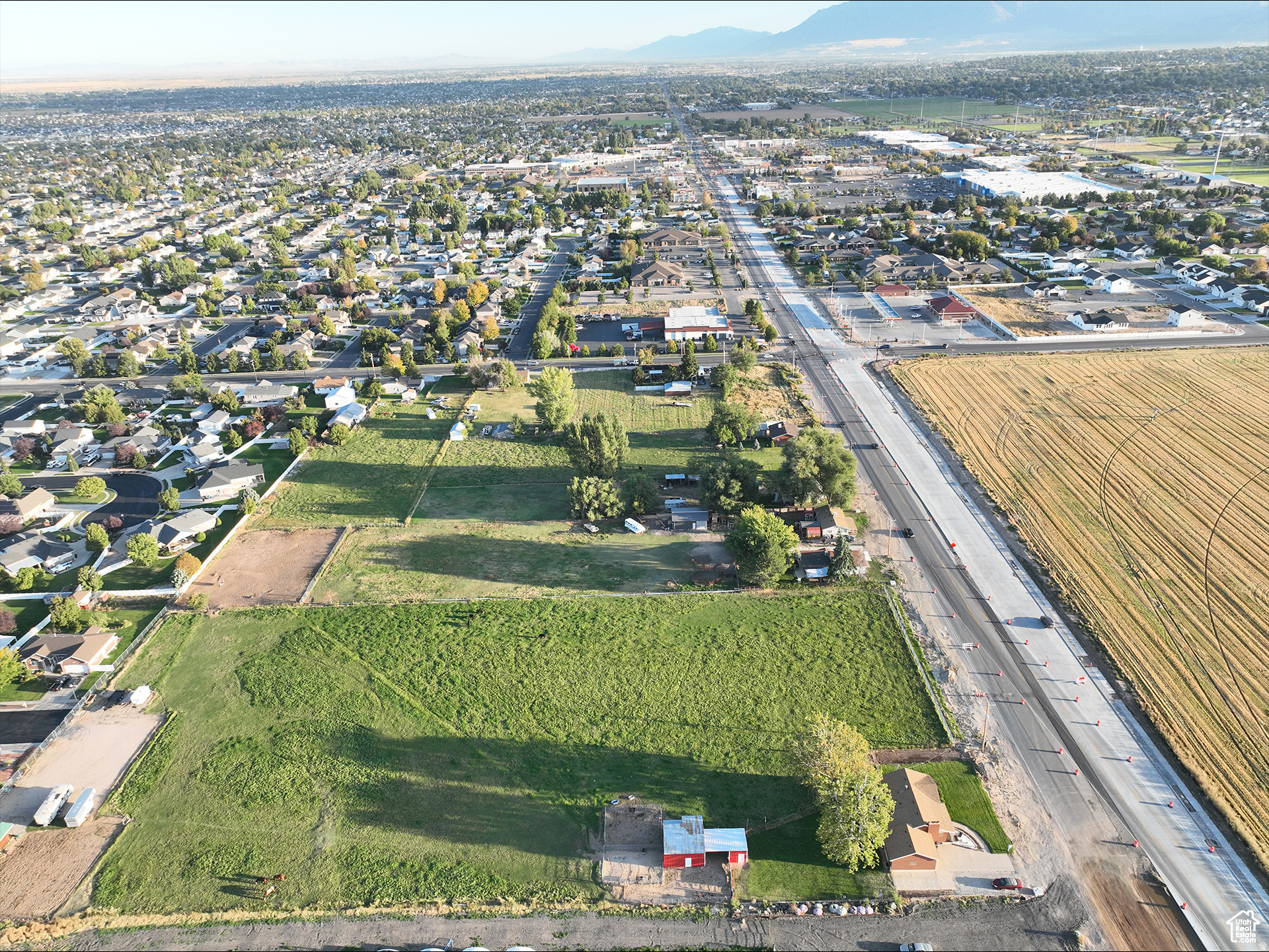 Commercial Property Located in the Heart of Clinton on 2000 West. Near New Commercial Amenities, Walmart & Other Large Retailers. With Close to 30,000 Vehicle Per Day Traffic, This is an Ideal Location. Front Portion in Master Plan as "Performance Zone" or Clinton's Commercial Zone. Total Lot Size is 4.87 Acres and is a part of TAX ID# 14-053-0098. New Parcel will Be Created. Only Approximately 3.28 Acres of Commercial is Being Sold.