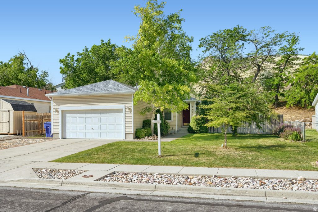 Welcome to this inviting rambler tucked away in a quiet, Magna neighborhood. This well maintained home features  a comfortable layout with plenty of natural light, 3 bedrooms, 2 baths, an updated kitchen, newer roof and A/C, a fully fenced yard and additional paved and\ RV parking. You'll appreciate the abundance of storage, including a spacious crawlspace that spans the full footprint of the home, providing exceptional room for seasonal items, household belongings and more. You'll enjoy outdoor living on the covered, maintenance free deck. Surrounded by mature trees and vibrant plants, this peaceful outdoor space offers a perfect setting for morning coffee, gardening, unwinding in the evenings, hosting gatherings or simply enjoying the sights and sounds of nature. With no rear neighbors, you'll enjoy a sense of seclusion and tranquility that's hard to find. Conveniently located near schools, parks, shopping and easy access to major highways, this home offers the perfect blend of comfort, value and location.