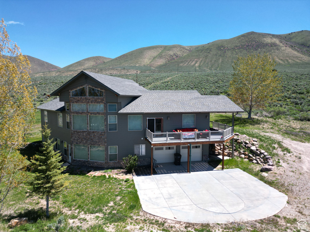 East Side Bear Lake Rambler with Sweeping North-to-South Views. A 5-bedroom retreat with a sleeping loft & 3 full baths, thoughtfully designed in a ranch-style rambler layout that showcases breathtaking panoramic views from every room. This getaway features vaulted ceilings, an airy open-concept floor plan, & wall-to-wall windows that flood the home with natural light & stunning lake vistas. Unwind on the deck as the sun sets over the water, host unforgettable gatherings with family & friends, or capitalize on the short-term rental income opportunity, all nestled on 1.13 acres with no HOA & plenty of room for all your toys. This is your chance to own a piece of Bear Lake magic - a place to gather, invest, and create lasting memories for generations to come.