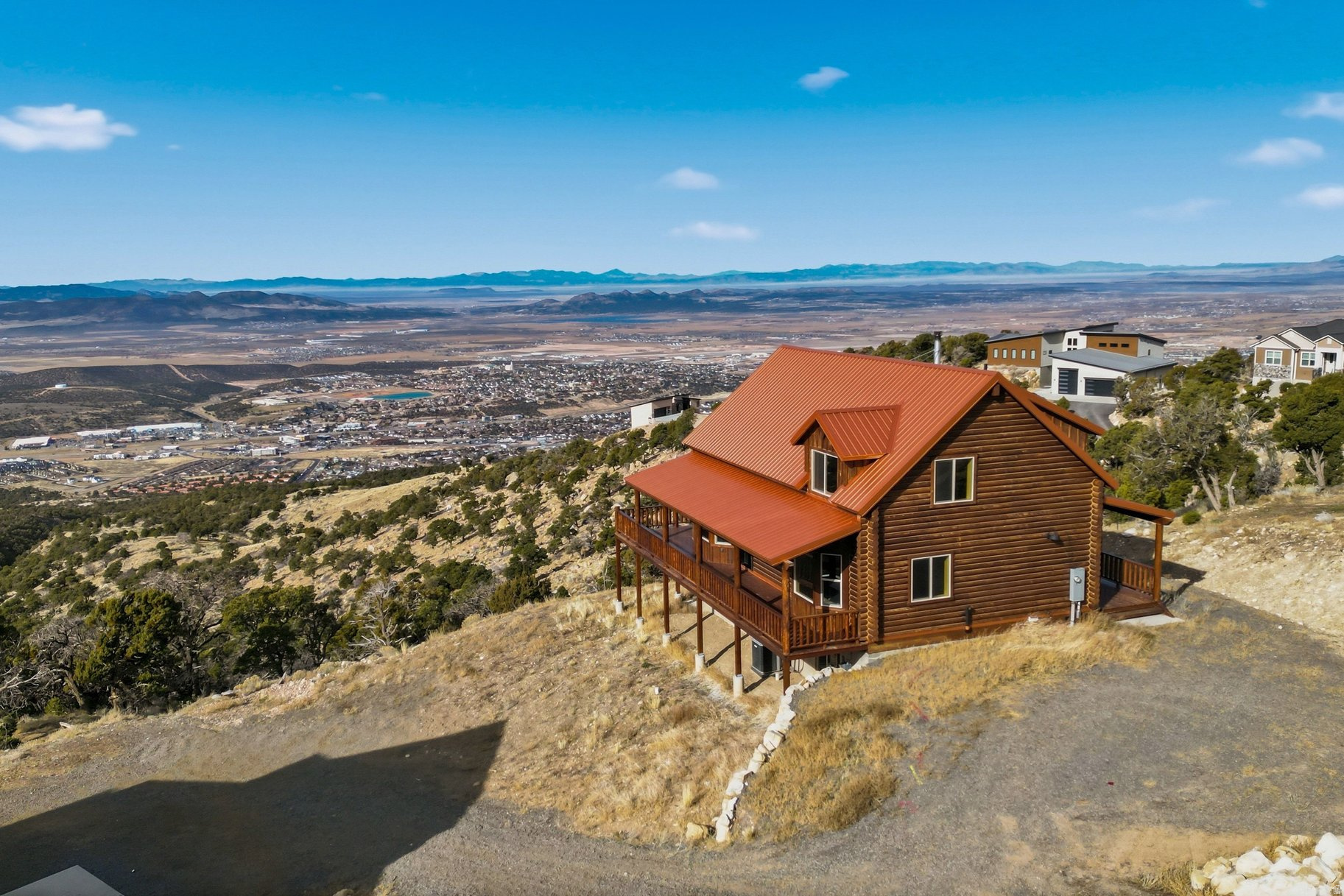 At just under 8,000 feet in the stunning subdivision of Cedar Highlands, this beautiful cabin offers all 2,400 sqft of living space across 3 levels. Enjoy the expansive breathtaking views of the Cedar City Valley in the large living room with 20' ceilings. This chalet-style cabin has panoramic mountain and valley views that can be taken in from the large semi-wrap around covered porch with an acre of land perfect to add a detached garage. The cabin features 3 bedrooms, 3 baths, large windows, vaulted ceilings, granite countertops, fireplace, large loft with ensuite, and wood burning stove. The basement offers a large open space with a fireplace, sliding doors, and plenty of closet space. Just over 2 hours from Las Vegas, and at almost 6,000 feet of elevation, Cedar City is one of the most beautiful cities in Southern Utah. It is home to Southern Utah University and the Shakespeare Festival, as well as amazing restaurants. As part of Southern Utah, you will experience a lifestyle like no other. The area features nearby internationally recognized mountain biking trails, road cycling, hiking, golf courses, national parks such as the Grand Canyon, Zion, & Bryce, national moments, national forest, reservoirs, & some of the most iconic desert landscape in the world. Less than hour away from Brian Head Ski Resort, there is no doubt that this is a fun place to live and play.All information herein is deemed reliable but is not guaranteed. Buyer is responsible to verify all listing information, including square feet/acreage, to buyer's own satisfaction.