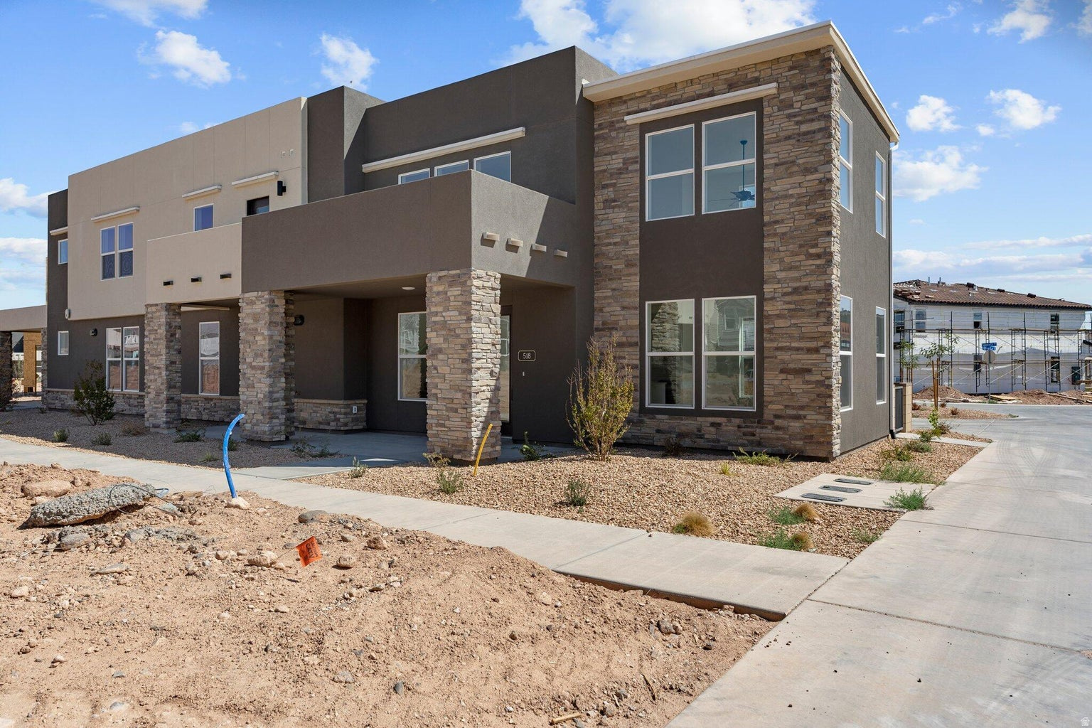 Move-in Ready new construction by Holmes Homes in the highly desirable Desert Color! Just steps from the brand-new resident-only pool, this stunning Verona floor plan showcases dramatic 20-foot vaulted ceilings and walls of windows that flood the home with natural light. Premium finishes elevate the space, while the extra-large 2-car garage offers plenty of room for vehicles, toys, and storage.