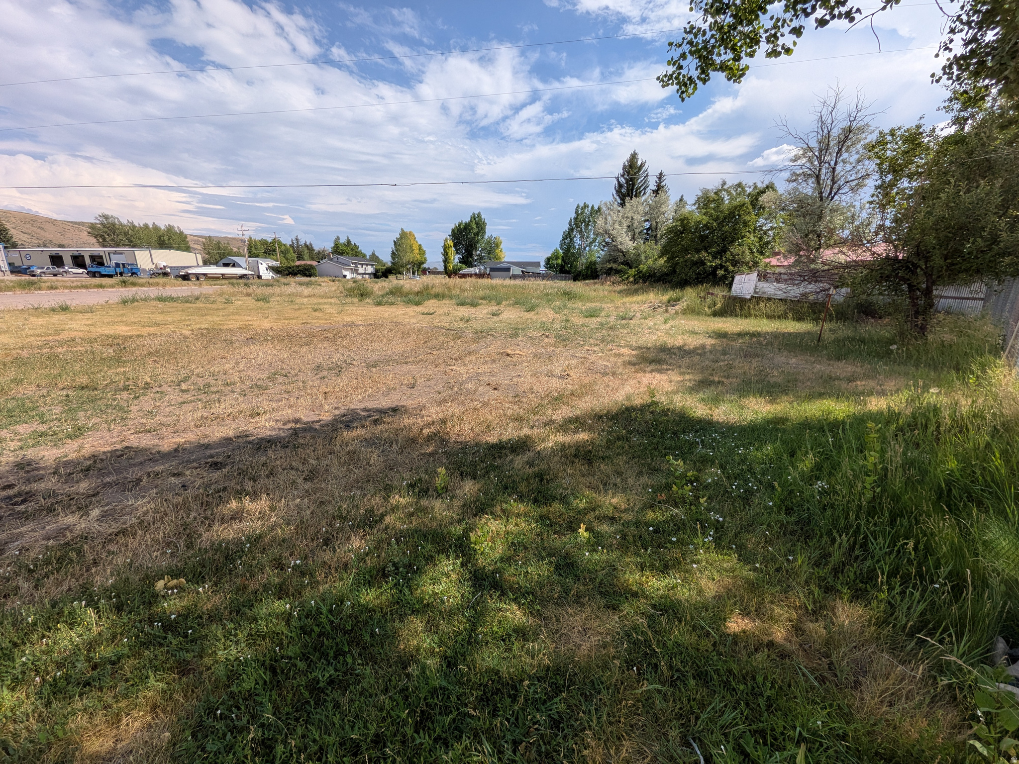 Build your dream home or investment property on this .17-acre buildable corner lot in one of Montpelier's desirable neighborhoods! With utilities available to be installed, this property is ready for your vision. Nightly rentals are allowed, making this an excellent opportunity for investors seeking short-term rental income or future development. Enjoy the convenience of being just steps from local amenities, including the dog park, walking path, pickleball courts, baseball diamonds, restaurants, grocery store, and car wash-all within walking distance. Whether you're looking to build your forever home, a vacation getaway, or an income-producing property, this ideally located lot offers the perfect combination of neighborhood charm, flexibility, and everyday convenience. Don't miss this exceptional opportunity in the heart of Montpelier! Square footage figures are provided as a courtesy estimate only and were obtained from Bear Lake County.  Buyer is advised to obtain an independent measurement.
