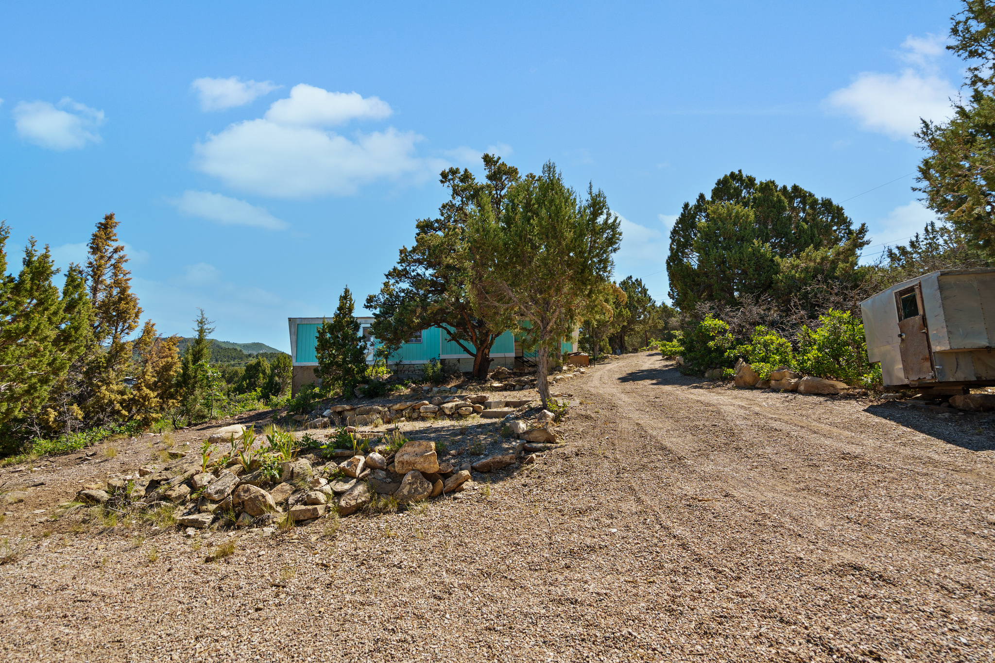 Year-round access lot in Skyline Mountain Resort with stunning views of Fairview Valley! This lot is ready for your dream cabin or home-or enjoy it as-is with the vintage trailer already on site. Just far enough to feel like a true getaway, yet close enough for easy access when needed. Enjoy all the community amenities including a pool, clubhouse, rental cabins, RV park, golf course, and endless outdoor recreation. A perfect mountain escape!
