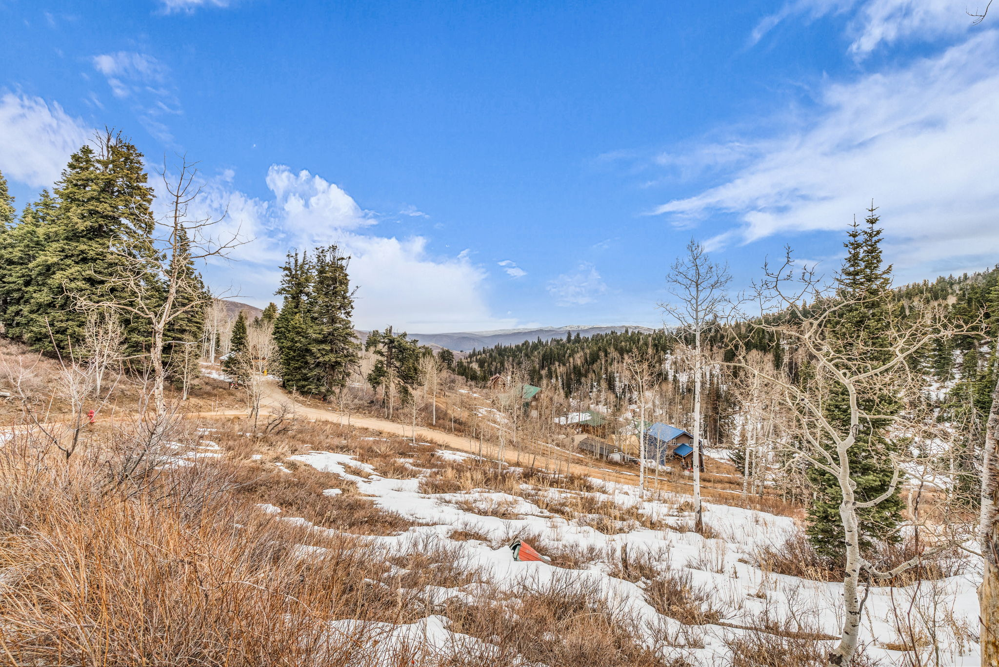 Welcome to Tollgate on Navajo. Your private mountain escape just minutes from Park City.  Discover the perfect blend of serenity and convenience with this wooded homesite in Tollgate Canyon. Located directly off I-80, this property offers peaceful mountain living without sacrificing accessibility.  Situated near the main plow route with a gentle slope, this lot provides an easier build opportunity compared to many mountain properties. A 2020 perc test and survey are available, adding valuable groundwork for your future plans. Short term rentals are allowed, providing investment flexibility.   Enjoy nature at its finest - peace and quiet, abundant wildlife, or even a spontaneous game of pick-up ice hockey in the winter. Experience the feeling of being worlds away while still close to everything you need.  Easy access: From I-80, take Tollgate Canyon Road, continue down Arapaho Dr, turn right on Pine Meadow Dr, then turn left on Navajo Rd from the bottom. Please note that 4-wheel drive and snow tires may be required depending on weather conditions.  Buyer to verify all listing information, including square footage and acreage, to their own satisfaction.
