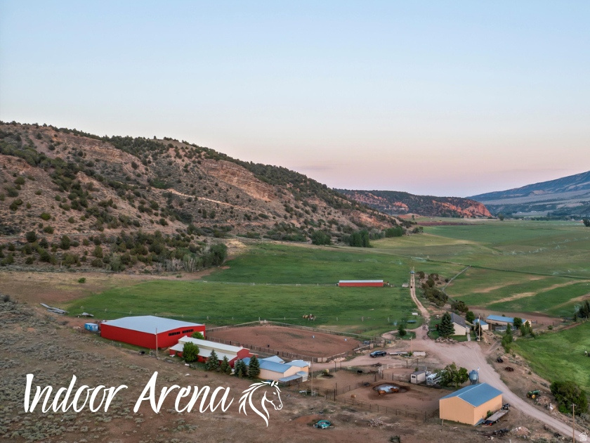 The property is currently being subdivided into two parcels, giving an option to purchase the home with the outbuildings, barn, and indoor arena on 10 acres with 10 water shares, or a separate 31-acre parcel that includes 20 water shares. Postcard-perfect views from every angle set the stage for this hidden equestrian paradise, nestled at the end of a quiet dead-end road in Hanna, Utah, just one hour from Heber. Spanning 41.32 acres, this turnkey horse property is built for both function and serenity. With 30 valuable water shares, the land is well-equipped to support irrigated pasture, hay production, and all your livestock and equine needs-providing both abundance and sustainability for ranch life. The property borders open land with access to hundreds of miles of trails-ride straight from your barn into vast, scenic country with no need to trailer out. Equestrian facilities include a 120' x 40' all-metal stall barn with eight stalls, a 150' x 80' indoor riding arena for year-round training, and an outdoor arena for riding under open skies. A massive 80' x 40' open-sided hay barn provides generous storage, supported by two additional 60' x 25' open- sided pole barns, a 60' x 25' machine shed, a 12' x 48' lean-to shelter, a woodshed, and a charming chicken coop. The land is a peaceful blend of open pasture and native growth, with wild herbs thriving across the property-a place where nature whispers and horses thrive. The existing home offers comfort and practicality with 4 bedrooms and 2 bathrooms, a spacious layout that includes two family rooms anchored by a wood-burning stove. A large pantry, abundant cupboards, and generous closet space throughout make daily living effortless. Whether you live in the current home or build your dream retreat overlooking the valley, this is a rare opportunity to settle into a lifestyle rooted in peace, purpose, and the freedom of wide-open spaces. Property may be subdividable in 6 acre pieces , additional due diligence would be needed. Square footage figures and boundary lines are provided as a courtesy estimate only. Buyer is advised to obtain an independent measurement.