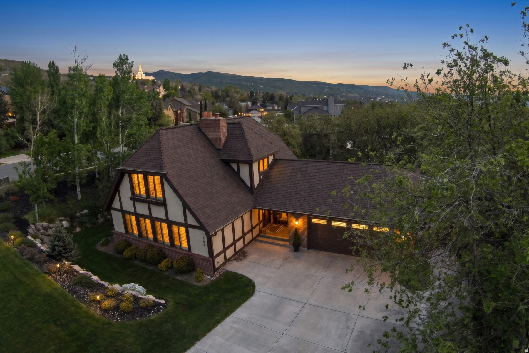 OPEN HOUSE Saturday, May 9, 1-4. Nestled in one of Bountiful's most sought after neighborhoods, this immaculate Tudor style home is straight out of a storybook. Full of charm and character, this beautifully updated residence offers 5 bedrooms, 4 bathrooms, including a main floor primary suite. Timeless architectural appeal blends seamlessly with modern updates. From the inviting curb appeal and professionally landscaped yard, to the warm, thoughtfully maintained interior, every detail reflects pride of ownership. Located within highly desirable Oak Hills Elementary boundaries, this home offers the perfect combination of charm, comfort, and location.  Square footage figures are provided as a courtesy estimate only and were obtained and estimated from county records. Buyer is advised to obtain an independent measurement. Price will not be adjusted based on future square footage measurements. Some exterior images enhanced with use of AI.