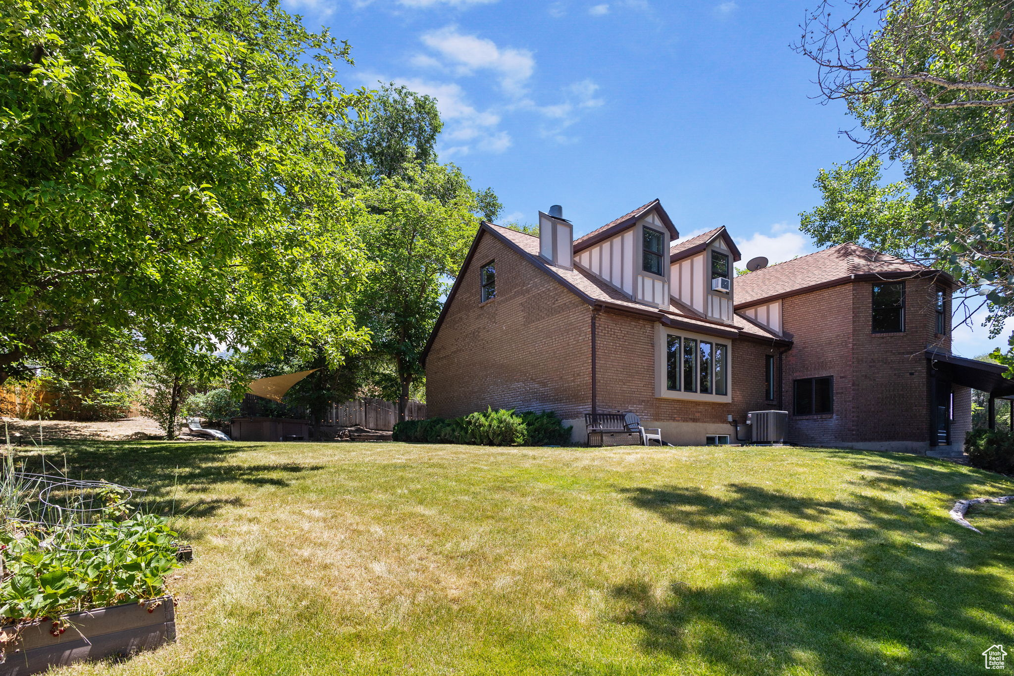 Welcome to your next home in the heart of Cottonwood Heights! Tucked away on a quiet cul-de-sac, this expansive 4,721 sq ft home sits on a private 0.40-acre lot and offers the perfect blend of space, versatility, and comfort. With 6 bedrooms, 3.25 bathrooms, 2 kitchens, and 3 distinct living rooms, the layout is ideal for multi-generational living, entertaining, or simply spreading out in style. Step inside the grand entry foyer, where the scale and flow of the home will immediately impress. The main level features a spacious living room with city views with a cozy fireplace, a formal dining room. Enjoy a well appointed kitchen with semi-formal dining space and a breakfast bar, perfect for everyday meals or special gatherings. You'll also find a 3/4 bathroom, a laundry room, and an additional family room with fireplace. Upstairs, has 4 generously sized bedrooms and 2.5 bathrooms, offering ample space for family/guests. The fully finished basement includes a second kitchen, living room, and two additional bedrooms. Plus a private side entrance, creating a perfect setup for a future Internal Accessory Dwelling Unit (ADU) with rental income, or comfortable mother-in-law family/guest quarters. Enjoy peace of mind with major updates already completed: New air conditioner and water heater, both replaced in 2024. All appliances included, Main Living Room TV included, Hot Tub included! Located in a prime east bench neighborhood just steps from the Cottonwood Heights Recreation Center, and minutes from Willow Creek Country Club and the world-class outdoor recreation of Big and Little Cottonwood Canyons. Rarely does a home of this size and potential come available in such a sought-after location, don't miss your chance! Square footage figures were obtained from county records. Buyer and Buyers Agent to verify all.