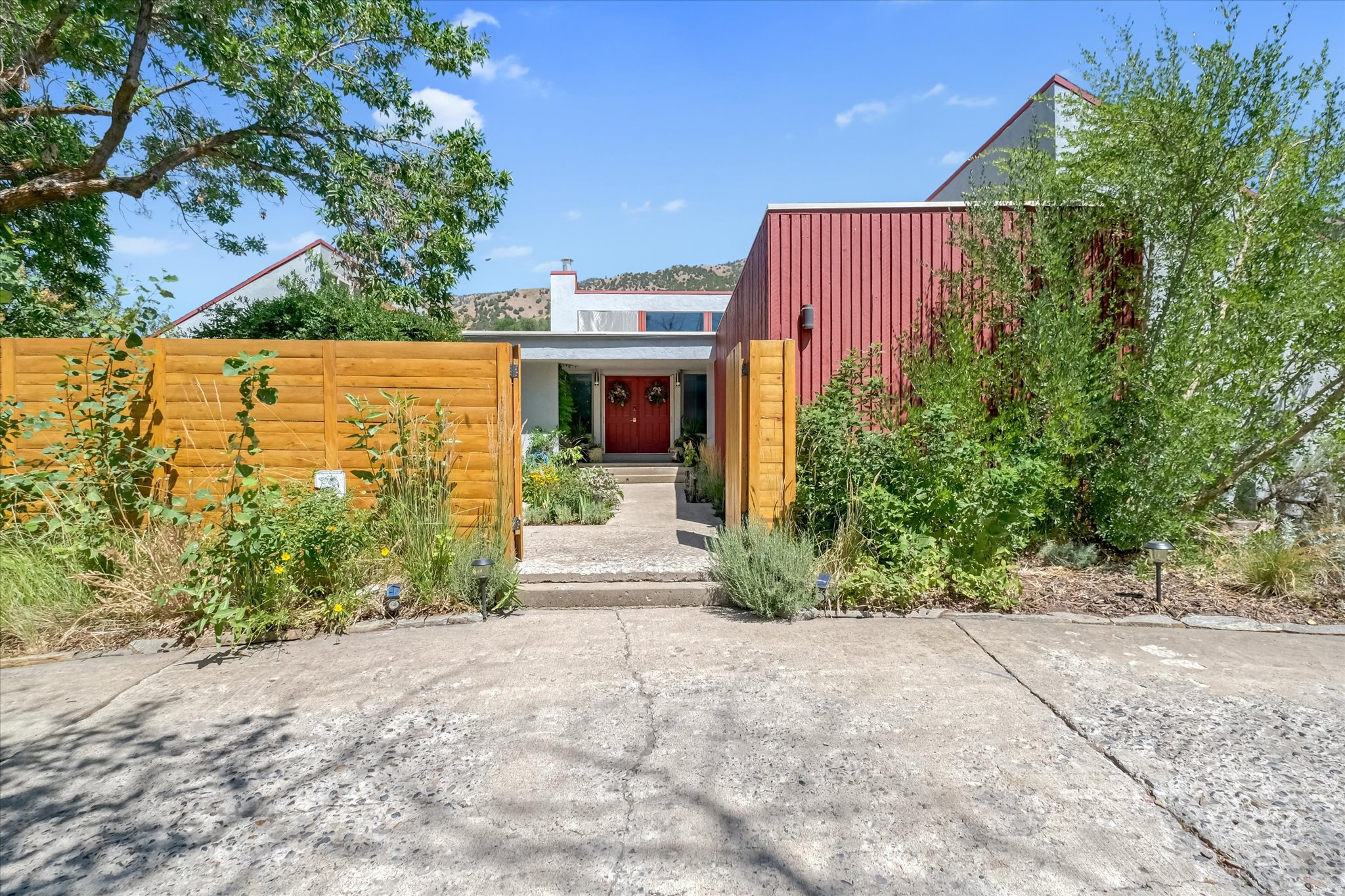 Built in 1974, this modern contemporary home absorbs the natural beauty of the surrounding property with large windows to the east capturing the morning sun, while the clerestory windows beckon the setting sun to the west, allowing natural light to flow through the home from dawn till dusk. From the moment you enter the property and pass through the courtyard, you quickly realize the magic and warmth of Home. The five bedrooms are perfectly situated in the 3700+ sqft floor plan, with a large theatre room, walk-out basement, large kitchen and plenty of space for relaxing and entertaining. The living space doesn't end at the exterior walls, but extends past the expansive decking and flows into beautifully curated pollinator gardens and beyond to the ravine and creek bed on the back of the .67 acre lot. Find solace in the garden retreat, alone or with your guests, and write the next chapter in the life of this stunningly unique and enchanted sanctuary. Bella is truly a place to behold and invites you to experience what words alone cannot adequately articulate. Schedule your private showing today and see for yourself where architecture and nature meet. Buyer to verify all information.