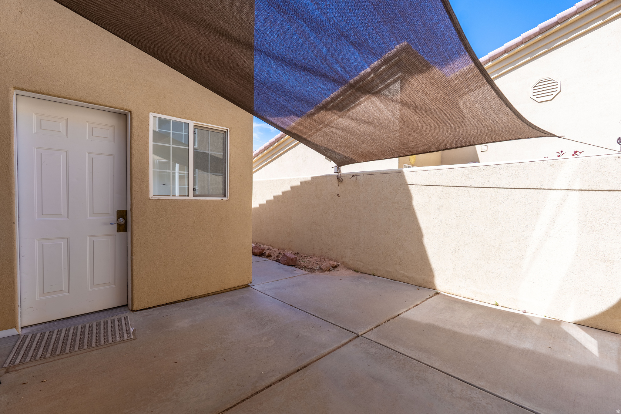 This 2 bed 2 bath townhome in Orchard Villa has been thoughtfully updated throughout with newer cabinetry, Corian countertops, quality appliances, bar-top seating, and luxury vinyl tile flooring. The primary suite has a dual vanity with a separate tub/shower and toilet, and a large walk-in closet. The second bedroom sits just off the second full bathroom/laundry room combo. Enjoy outdoor living in the private front courtyard with an added shade canopy, or out the sliding glass back doors that lead to your private patio and shared lawn. There is plenty of parking and storage in the two-car garage with attic space, plus an extended driveway. Community amentities include a pool and extra parking for your campers, side by sides, or extra vehicles. Orchard Villa is conveniently located walking distance from the hospital, a convenience store, a local coffee drive through, the BMX park, and biking/walking trails. Nightly renting is not permitted. This property is in a community reinvestment area and qualifies for a community reinvestment act mortgage loan (CRA). As little as 3% down. To prequalify for special financing, contact listing agent.