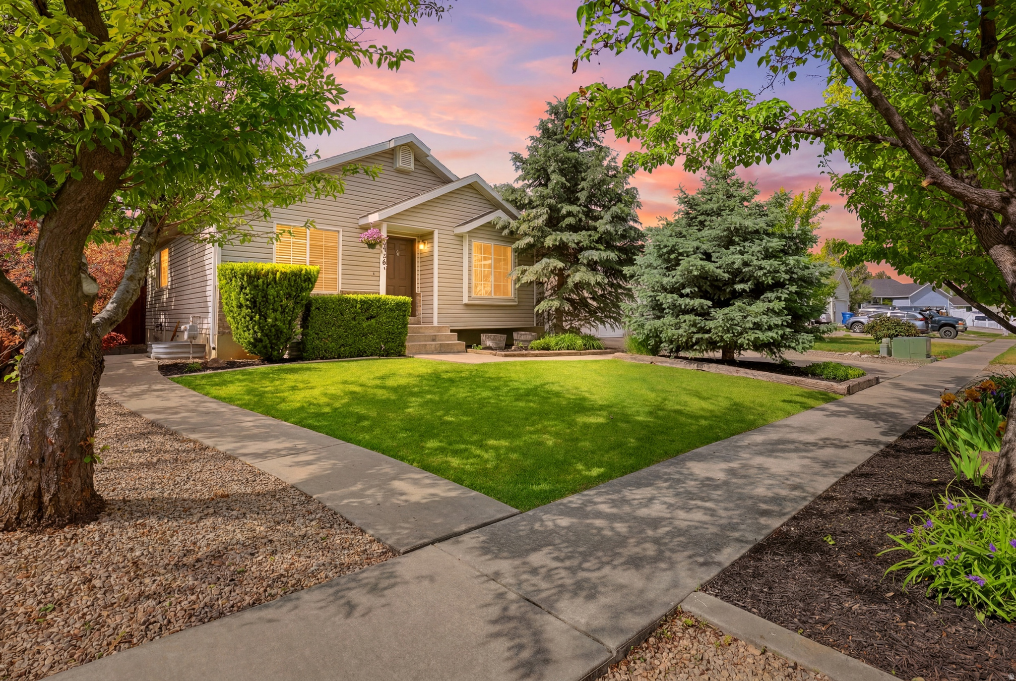 Nestled in an established Spanish Fork neighborhood, this beautifully maintained rambler offers the perfect combination of space, functionality, and comfort. With 5 bedrooms, 3 bathrooms, and 2,376 square feet of living space, this home provides room for everyone while offering a warm and inviting layout designed for everyday living. The main level features vaulted ceilings that create an open, airy feel, along with a bright and functional kitchen, comfortable living space, and a spacious primary suite with its own private bath. The fully finished walkout basement adds incredible flexibility with additional bedrooms, a large family room, and separate access, making it ideal for guests, multi-generational living, a home office setup, or simply extra room to spread out. Step outside to enjoy the fully landscaped yard complete with mature trees, full fencing, automatic sprinklers, and plenty of room to relax, entertain, or let kids and pets play. RV parking adds extra convenience for trailers, toys, or additional vehicles, while the attached 2-car garage provides practical everyday storage and parking. Located in a desirable Spanish Fork neighborhood with mountain views and easy access to schools, parks, shopping, and local amenities, this home offers the space and versatility buyers are looking for in a location they'll love. Whether you're needing room to grow, space to host, or a home with flexible living options, this one is ready to welcome you home. Back on the market due to buyer circumstances. No fault of the home!!   Square footage figures are provided as a courtesy estimate only and were obtained from county records .  Buyer is advised to obtain an independent measurement.