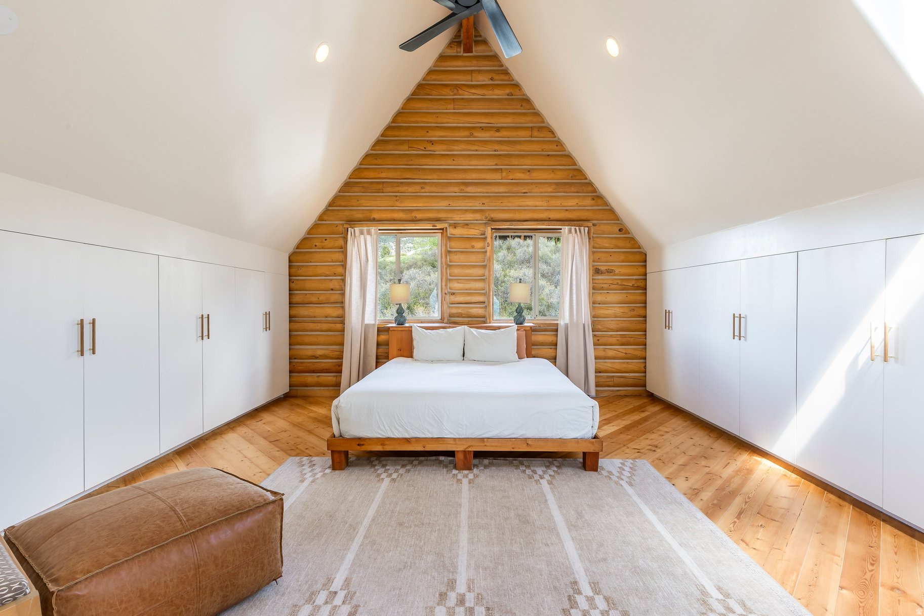 Set on 5 breathtaking acres in the Kamas Valley, this extraordinary handcrafted mountain property offers a rare blend of artisan craftsmanship, privacy, water rights, and panoramic views stretching from Mt. Timpanogos to Deer Valley and the Park City ski resorts. Designed and built by a master timber craftsman, the home showcases exceptional Swedish cope Douglas fir log construction, hand-quarried Park City sandstone floors and countertops, custom woodwork, radiant floor heat, passive solar design, and a vintage WWI-era Heatrola stove. The beautifully updated 4-bedroom residence has undergone extensive improvements from 20222026, including new Andersen windows and doors, a new metal roof, refreshed interiors, custom cabinetry and closets, updated outdoor living spaces, and professionally maintained landscaping with fruit trees, gardens, drip irrigation, and stone terraces.  Offered with Lots 83 and 84, this unique legacy property includes established Weber River water shares, two productive wells, a greenhouse with utilities and irrigation, a 4,000-gallon water storage system, and a separately recorded buildable lot with incredible ski area views. Ideal for horses, recreation, or a private mountain retreat, the property offers direct access to the Uinta Mountains for year-round adventure including hiking, horseback riding, fishing, skiing, and camping. Rarely does a property combining this level of craftsmanship, infrastructure, land, and natural beauty become available.