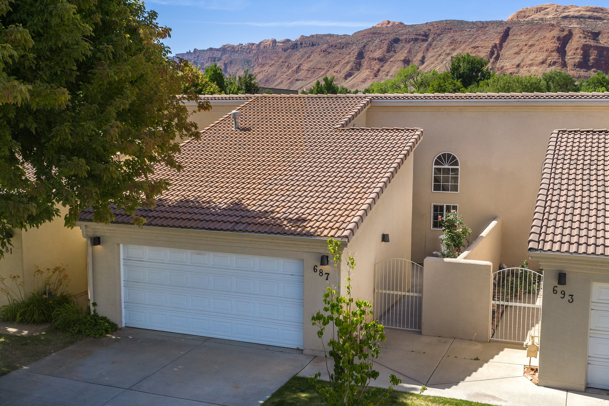 Lovely quiet townhome centrally located near churches/City Park/ indoor/outdoor pool and playground. Lovely courtyard entering the front door. This has an open floor plan with a large open kitchen. New brushed appliances 5 years ago. Great counter space! All wood cabinetry and storage galore. Large combination dining and living room with corner gas log fireplace. Roomy main bedroom with large en-suite, large walk-in closet, vanity with double sinks. Both bedrooms and living room have new ceiling fans. Vaulted ceilings in kitchen, living room and main bedroom. This townhome offers a large 2-car garage with plenty of room for shelving. Covered back patio off living room. All of this and more $465,000. Very friendly neighborhood.