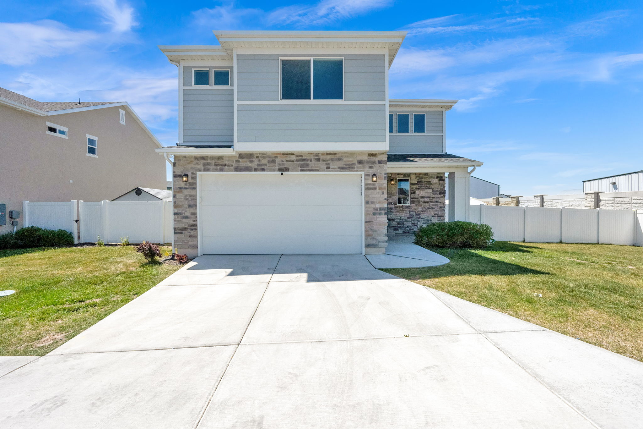 Beautiful newer construction home in Still Water offering comfort, style, and a bright open layout designed for everyday living. The main level features 9' ceilings, durable flooring, quartz countertops, shaker cabinetry, brand new stainless steel appliances, and a large kitchen island that opens nicely to the great room. Upstairs includes 4 bedrooms with brand new capret, 2.5 bathrooms, a spacious primary suite with dual vanities, a large walk-in shower, and an oversized walk-in closet.  Set on a 6,098 sq ft lot, this home offers one of the larger yard configurations among Still Water's shared-drive homes, giving buyers more usable outdoor space than is typical for this product type. The fully fenced yard, attached 2-car garage, and clean modern exterior complete the package. Still Water is one of Syracuse's most desirable communities, known for its well-used amenities and strong neighborhood feel. Residents enjoy a large community pool, clubhouse, exercise room, and multiple playgrounds throughout the neighborhood. Conveniently located with easy access to the new West Davis Corridor, and near the BMX/Equestrian Park, a new elementary school scheduled to open in fall 2026, and the future Syracuse Regional Park.