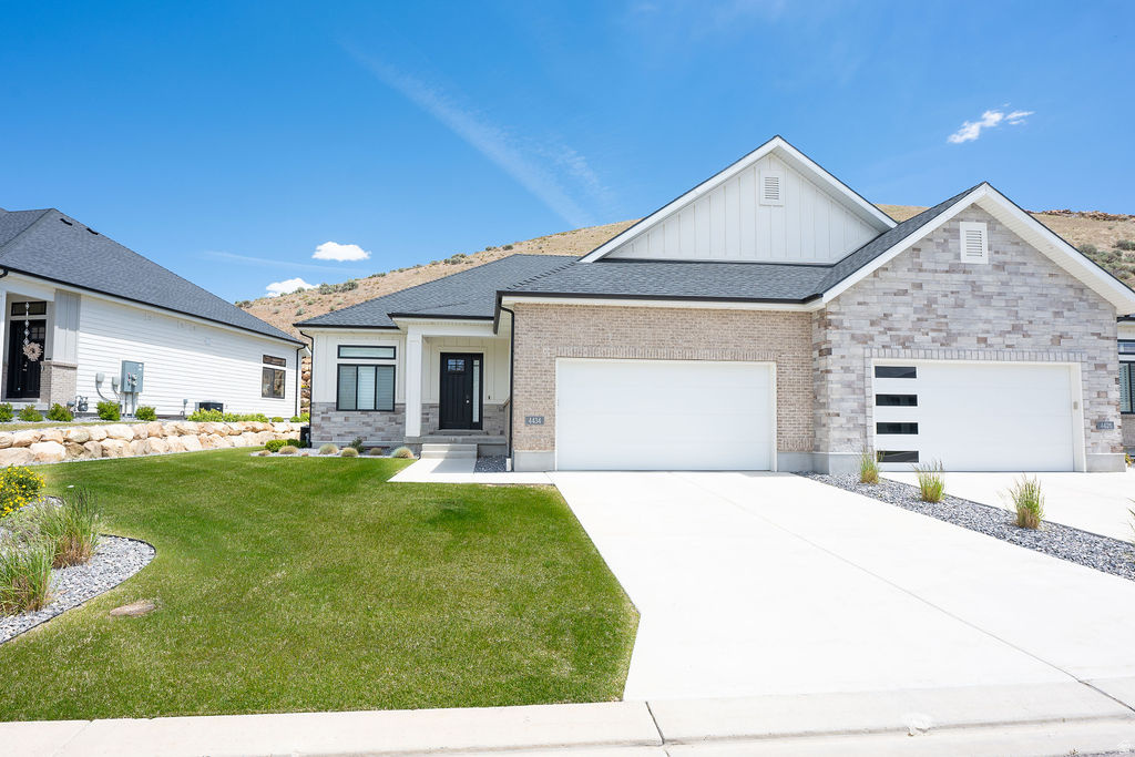 Welcome to luxury, low-maintenance living in the highly desirable Traverse Mountain community! This beautifully upgraded twin home offers the perfect blend of elegance, comfort, and convenience, featuring over $50,000 in premium upgrades and exceptional finishes throughout. Step inside and immediately appreciate the spacious open-concept floor plan, soaring 10' and 11' ceilings, stunning hardwood flooring, and elegant tray ceiling detail in the main family room. Designed for effortless main-floor living, this home showcases quality craftsmanship and thoughtful upgrades at every turn. The gourmet kitchen is a chef's dream, featuring custom light wood cabinetry, premium Caf stainless steel appliances, double ovens, a gas cooktop, microwave, dishwasher, and abundant counter and storage space perfect for entertaining family and friends. The luxurious primary suite provides a private retreat with a spa-inspired bathroom offering dual vanities, a freestanding soaking tub, a custom-tiled walk-in shower with Euro glass enclosure, and a professionally designed closet system complete with built-in drawers and pull-down hanging rods for maximum functionality. Enjoy cozy evenings by one of two gas fireplaces, located on both the main level and basement. The conveniently located main-floor laundry room adds to the home's ease and functionality. The fully finished basement expands your living space with a large family room, two spacious bedrooms, an upgraded bathroom featuring a tiled shower and Euro glass door, and a stylish kitchenette complete with a sink, microwave, and mini refrigerator. A potential oversized theater room located beneath the garage creates the ultimate entertainment space for movie nights, sporting events, and gatherings. Additional upgrades include a central vacuum system, fully finished garage with epoxy flooring, insulated garage door, extensive storage throughout, custom cabinetry, hardwood flooring, and over $50,000 in builder and post-construction upgrades. Enjoy a truly maintenance-free lifestyle with HOA-provided landscaping and snow removal, including service right to the garage door and front entry. Residents enjoy access to private community amenities, including a clubhouse, fitness center, swimming pool, pickleball courts, BBQ area, and community classes and events.This exceptional home offers luxury, convenience, and carefree living in one of Lehi's most sought-after neighborhoods. Square footage figures are provided as a courtesy estimate from builder plans. Buyer is advised to obtain an independent measurement. Seller is owner/agent. Listing agent is related to the seller and is a licensed Utah real estate agent.