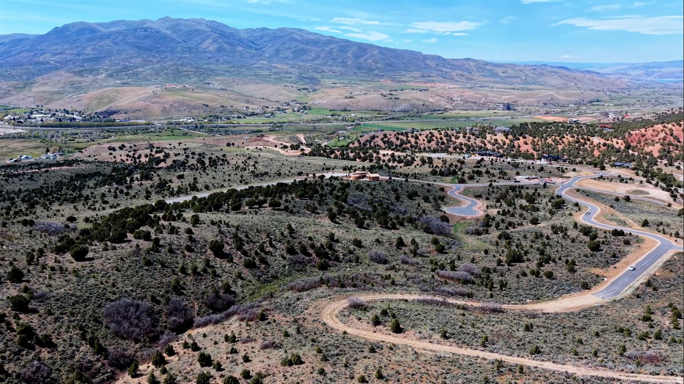 Experience the rare opportunity to build your dream mountain estate on 1.95 spacious acres at Cherry Ridge Lot 28, one of only 30 exclusive homesites in the private Cherry Ridge community. Nestled in the scenic hills of Cherry Canyon, this exceptional property offers breathtaking mountain and valley views, abundant privacy, and direct access to year-round outdoor recreation. Cherry Ridge combines the tranquility of mountain living with modern conveniences, including paved roads, underground power, natural gas, high-speed fiber internet, and thoughtfully preserved open space. Miles of private trails provide opportunities for hiking, horseback riding, and wildlife viewing right from your doorstep. Unlike many luxury mountain communities, Cherry Ridge offers the freedom of ownership without mandatory club memberships or excessive restrictions. Create the custom home and lifestyle you've always envisioned while enjoying convenient access to Park City, Promontory, Blue Sky Ranch, world-class skiing, golf, dining, and Salt Lake International Airport. Protected view corridors, spacious estate lots, and a limited number of homesites create a truly unique opportunity in one of the Wasatch Back's most private and sought-after mountain settings. Come experience the beauty, tranquility, and possibilities of Cherry Ridge. Additional lots available. While the information provided is believed to be accurate and is intended to give a thorough overview of the property, buyers are advised to independently verify all information and complete their own due diligence.
