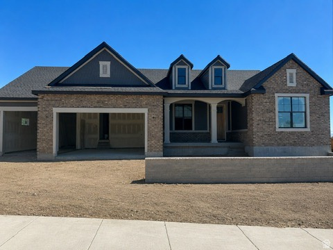 LOT #117 - The "Treble" plan by Symphony Homes is sure to be a standout, with an estimated completion in September. Designed in a timeless farmhouse style with brick and Hardie exterior, this home offers an open, spacious layout with thoughtfully curated designer finishes throughout. Interior highlights include custom wainscoting, shiplap accents, crown molding, a beautiful fireplace, and a built-in mudroom bench with hooks. The galley-style kitchen is both functional and refined, featuring a column refrigerator and freezer, double wall ovens, a 36" 5-burner gas cooktop, and a butler's pantry. The fully finished basement is designed for entertaining, complete with a game room, wet bar, one full bathroom, one half bathroom, and a large finished storage room with built-in shelving, plus additional cold storage. Enjoy outdoor living on the covered patio, and take advantage of the extended 41' deep third-car garage-perfect for extra vehicles, toys, or storage. Full landscaping is included.