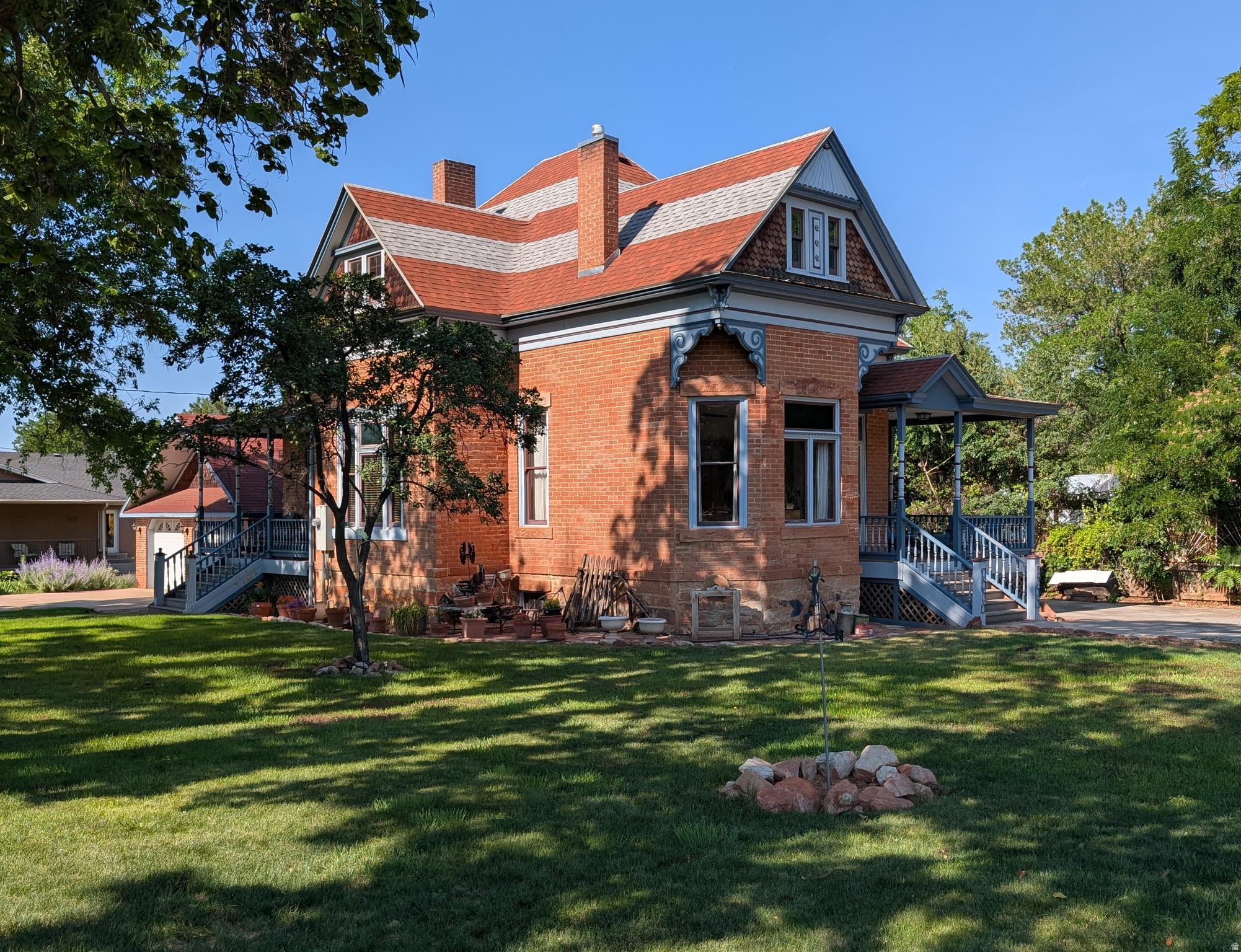 This historic home was built by John Rider, one of the early settlers of Kanab and a master builder who contributed significantly to the town's development. This historic home, listed on the National Registry of Historic Places, has remained in the Rider-Pugh family for the past 132 years. It has gone through many updates (electrical, plumbing, and heating/cooling) while retaining the character of its historical past. The house is conveniently located one block from downtown Kanab, which gives it a high walkability score. With approximately 4,000 square feet of living area (including 3,400 square feet of finished space and 700 square feet of unfinished storage), this home offers 5 bedrooms and 2 bathrooms  (1)-Full and (1)-3/4. The first-floor north bedroom is a standout feature, boasting its own private entrance  making it an ideal home office. Just off the kitchen, you'll find a large bank of hallway cabinets providing excellent pantry storage. The kitchen was thoughtfully updated with washer and dryer hookups to accommodate a family member; these can easily be relocated to the basement if preferred. The home provides multiple comfortable gathering areas, including a large upstairs loft and a spacious basement family room with daylight windows and an exterior entrance/exit via steps. The yard features mature trees, including several fruit trees and grape vines. Enjoy the convenience of the automatic sprinkler system for the large front lawn. The fenced back yard has been used for a large vegetable garden, but can easily be converted to a play area or lush green grass. The detached 2-car garage was added in 2006 and mirrors the house's historic style. Concrete was added to the main driveway for additional parking and R/V storage in 2019. This home was appraised at $600,000 on February 25, 2026.