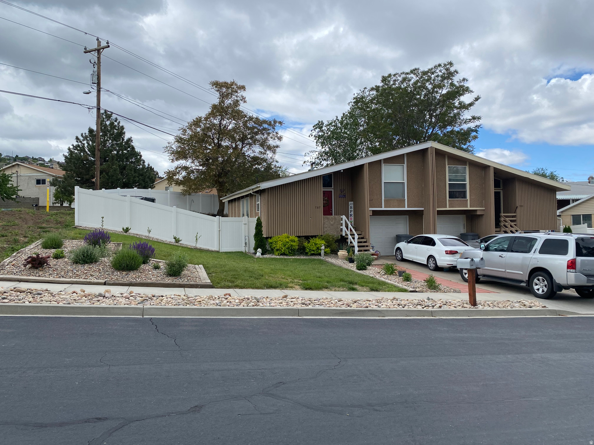 Exceptional investment opportunity featuring a well-maintained duplex located in a quiet cul-de-sac just minutes from downtown Salt Lake City. The property has maintained continuous occupancy for approximately 10 years, demonstrating a strong rental history, with leases currently in place through June 2027. Each unit offers 3 bedrooms and 1.5 bathrooms, providing spacious, functional living spaces that appeal to a wide range of tenants. A standout feature of this duplex is the separate fenced backyards for each unit, offering added privacy and outdoor living space not commonly found in similar properties. The thoughtfully landscaped, water-wise front yard showcases colorful flowers, mature shrubs, and an attractive red walkway, helping to minimize maintenance and water usage. The east unit has been extensively updated with newer carpet, fresh paint, a fully remodeled kitchen featuring newer appliances, and renovated bathrooms. The west unit has been well maintained and offers an opportunity for future updates while benefiting from long-term tenant occupancy. Whether you're looking to expand your investment portfolio or secure a property with established rental income, this duplex presents an outstanding opportunity in a convenient Salt Lake Valley location. *NO showings without accepted offer* Square footage figures are provided as a courtesy estimate only.  Buyer is advised to obtain an independent measurement.
