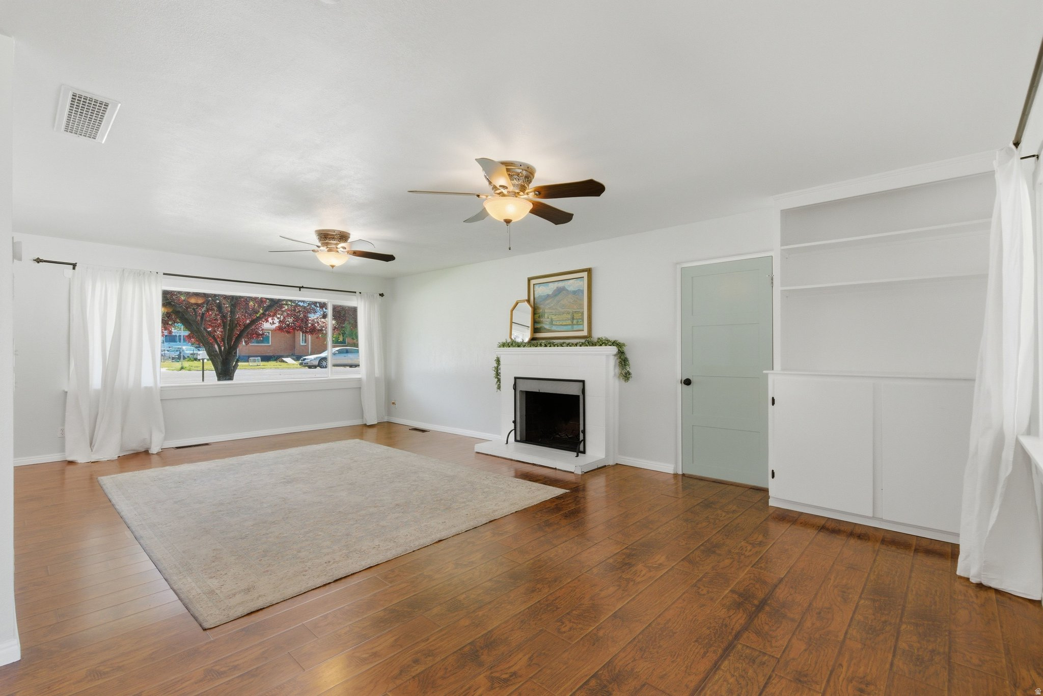 This charming home is located near the Provo River Trail and Exchange Park and offers mountain views to the east. The open floorplan and large covered patio with a built-in charcoal grill offers lots of space for entertaining. And if a walk-in closet is on your list, you'll definitely want to check out the primary ensuite bedroom. The yard features an established garden with strawberries, raspberries, and fruit trees (peach and pear) and two long driveways. Square footage figures are provided as a courtesy estimate only and were obtained from county records. Buyer is advised to obtain an independent measurement.