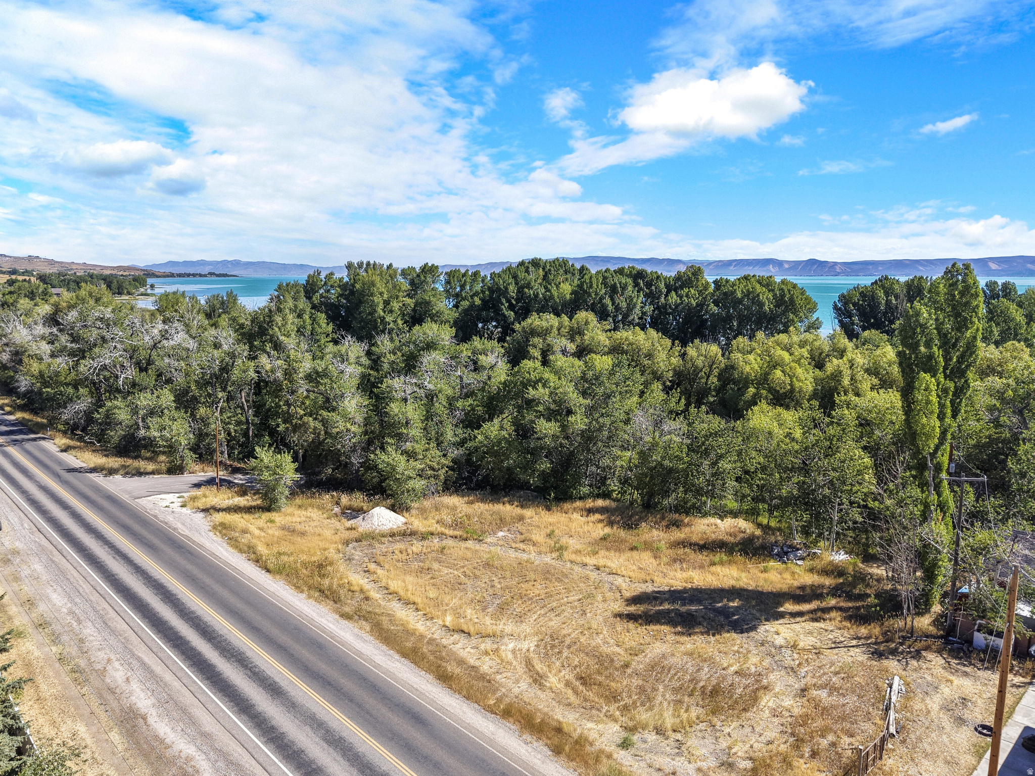 Brand-new Big Bear Subdivision, this .56-acre corner lot offers the perfect canvas to build your dream mountain-lake retreat with rare, deeded Bear Lake access. Perfectly situated for year-round recreation, you are located just 4 minutes from the Garden City Marina for seamless boat launching, and a quick 15 minutes from the gateway of Logan Canyon, where you can explore hundreds of miles of premier trails via hiking, mountain biking, 4x4s, and snowmobiles. As a prominent corner parcel, this property boasts enhanced curb appeal and excellent design flexibility, providing ample space for a custom home and a garage large enough to store all your lake and trail toys. Don't miss this premier opportunity to secure a prime piece of the Big Bear community- Start living the ultimate Bear Lake lifestyle today!