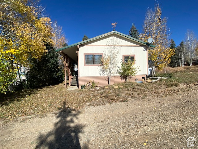 Square footage figures are provided as a courtesy estimate only and were obtained from country records..  Buyer is advised to obtain an independent measurement.  Well maintained and remodel 1961 trailer in prime condition, located within walking distance of Scofield Lake.  This spacious home features 4 bedrooms, 1 full bathroom, and 1 three-quarter bathroom.  Enjoy outdoor living with a large covered from porch, perfect for relaxing in all seasons.  A wood stove adds warmth and charm, while the durable metal roof offers long-term peace of mind.  A great opportunity for a lake-area retreat.