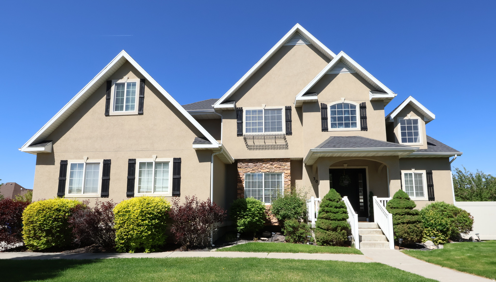 Ideally located near the end of a quiet cul-de-sac in one of north Lehi's most desirable school corridors, this spacious 4,060 sq. ft. combines convenience and everyday livability. Enjoyable walkable access to top-rated schools, quick freeway connections and a peaceful neighbor setting. With six bedrooms plus additional office/flex spaces, a main-floor primary suite, vaulted ceilings through the entry, living room, and kitchen, recently refinished real hardwood floors, finished basement with kitchenette, and abundant storage, the home is designed to accommodate gathering, working from home, guests, hobbies, and everyday life. The .276-acre lot is a standout, with mature trees, cherry and apple trees, garden boxes including blackberry bushes, a patio, in-ground trampoline, and recently refreshed landscaping rock and fabric. The garage features epoxy floors and adjustable storage shelving, while practical upgrades include AC/furnace systems approximately five years old, two newer 50-gallon water heaters, whole home humidifier, a radon mitigation system, and a EUFY front door camera with no subscription required. Enjoy no HOA, immediate occupancy, and a location close to Skyridge High School, Eaglecrest Elementary, Viewpoint Middle School, Lehi Middle School, Timpanogos Highway, I-15 access, shopping, dining, and Silicon Slopes. Furniture may be available separately or removed prior to closing. Buyer to verify all information.