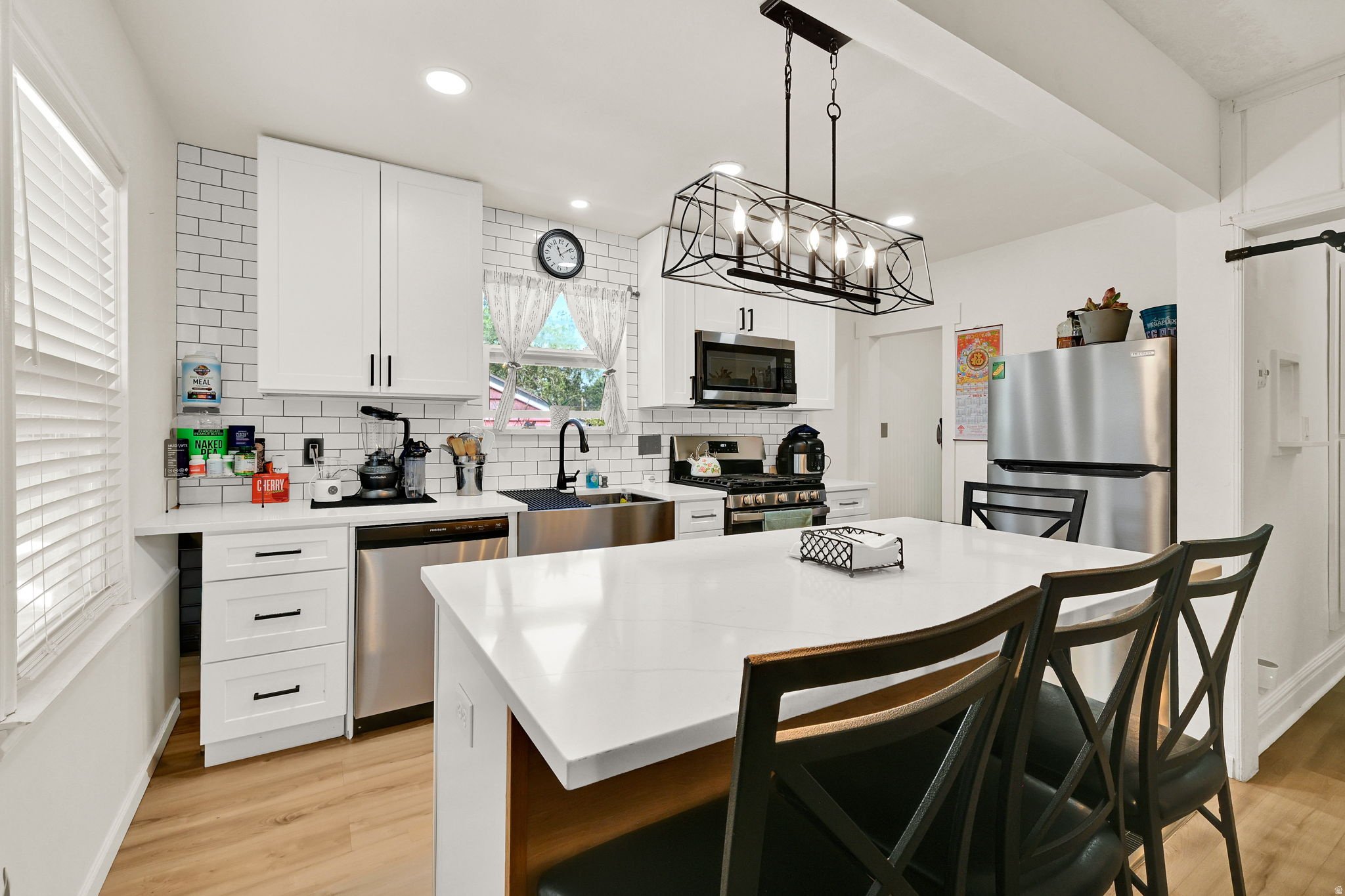 PRICE REDUCED! Welcome to this beautifully remodeled East Bench bungalow with mountain views and an unbeatable location. The chef-inspired kitchen features new cabinetry, stainless steel appliances, a gas range, and an open layout designed for everyday living and entertaining.  Outside, you'll find a spacious fenced yard with a patio, sprinklers, mature peach trees, and a detached garage. Enjoy quick access to hiking trails, outdoor recreation, shopping, dining, and schools, all while being tucked into one of Ogden's most sought-after neighborhoods.  Move-in ready and full of charm, this East Bench gem offers the perfect blend of comfort, convenience, and lifestyle. Come take a look today.