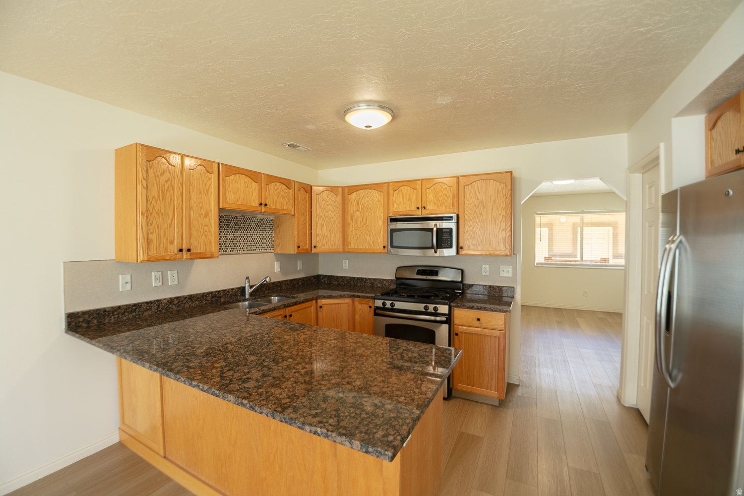PRICE REDUCED!!! Great Starter Home. Newly renovated townhouse located in North Ogden. Brand new flooring installed throughout the entire home. Offers two spacious bedrooms, a beautiful kitchen with granite countertops, and a private garage. Conveniently located close to schools, shopping, and outdoor attractions. What a beauty!!!