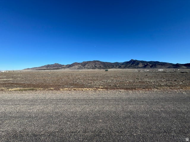 Fantastic 5ac lot available in the Broken Spur subdivision in Newcastle Utah. Right at the base of the Antelope Mountains. Paved road to the property for year round easy access. New water well installed in 2025. Pump will be installed before closing. Dixie Power line along East property line. Half acre foot of water right #71-5991 is included in the sale. Water right approved through a change application by the state in September 2025. Beautiful mountain and valley views. Build your dream home, 2nd home, or have a vacation retreat property to spend time w/ friends and family. Bring your RV, trailers, toys for getaways. Only 15 minutes to Newcastle Reservoir for boating and fishing. 50 Minutes to Cedar City or St. George. Cabin/Shed not included. 20 min to Enterprise for Food/Amenities.
