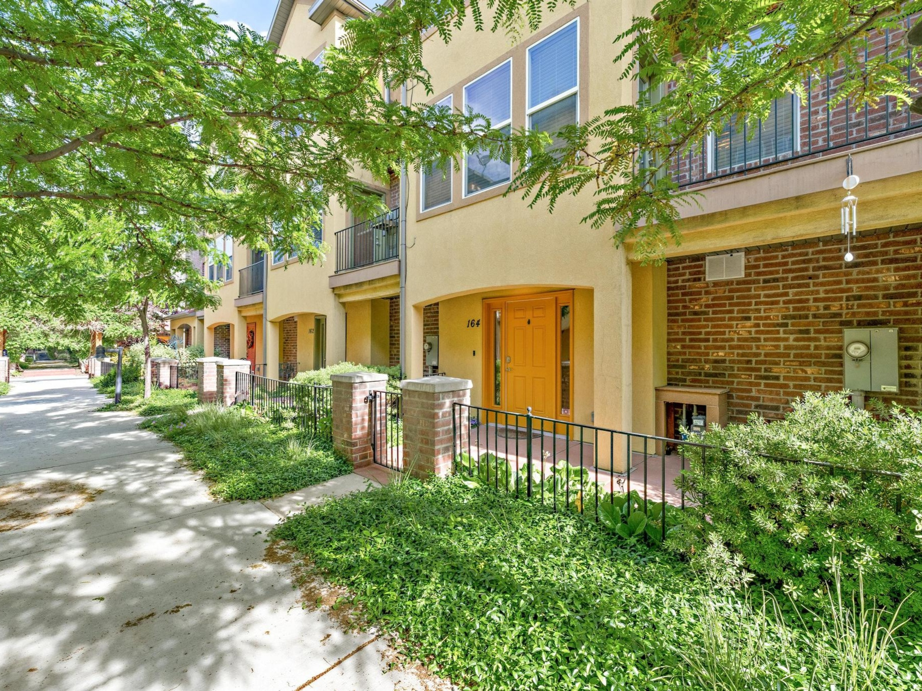 Set within a beautifully maintained community, this fully remodeled townhome delivers the rare combination of refined updates, affordability, and unmatched access. Just steps from the UTA TRAX station, downtown commuting becomes effortless. Inside, nearly every surface has been thoughtfully reimagined. Rich hardwood and LVP flooring flow throughout, while every bathroom has been completely renovated with a fresh, modern aesthetic. The kitchen serves as the centerpiece of the home, featuring updated countertops, a designer backsplash, a newly added gas line for the range, and a peninsula that creates a more open, inviting layout for gathering and entertaining. Fiber Internet and yard maintenance are included in the HOA!
