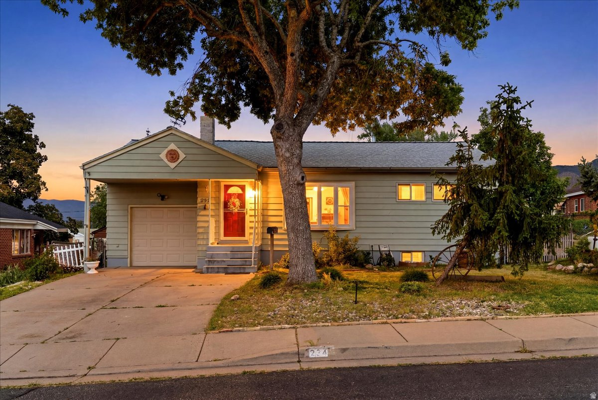 PRIDE IN OWNERSHIP! Bright and welcoming home located in a peaceful neighborhood with mountain views from both the kitchen and backyard. This home features charming original hardwood floors, updated windows, modern plumbing, and a beautifully updated kitchen (2019) with an Amish standalone pantry. Water heater replaced approximately two years ago. Carpet is located only on the stairs for easy maintenance throughout the rest of the home.  The main level offers 2 spacious bedrooms and a light-filled living room with a bay window. The basement includes a cozy family room and a private primary suite featuring a walk-in closet, updated shower, jacuzzi tub, and potential for a second kitchen. Enjoy the backyard patio, perfect for entertaining and outdoor gatherings. Move-in ready and conveniently located near local amenities, schools, and commuter access.