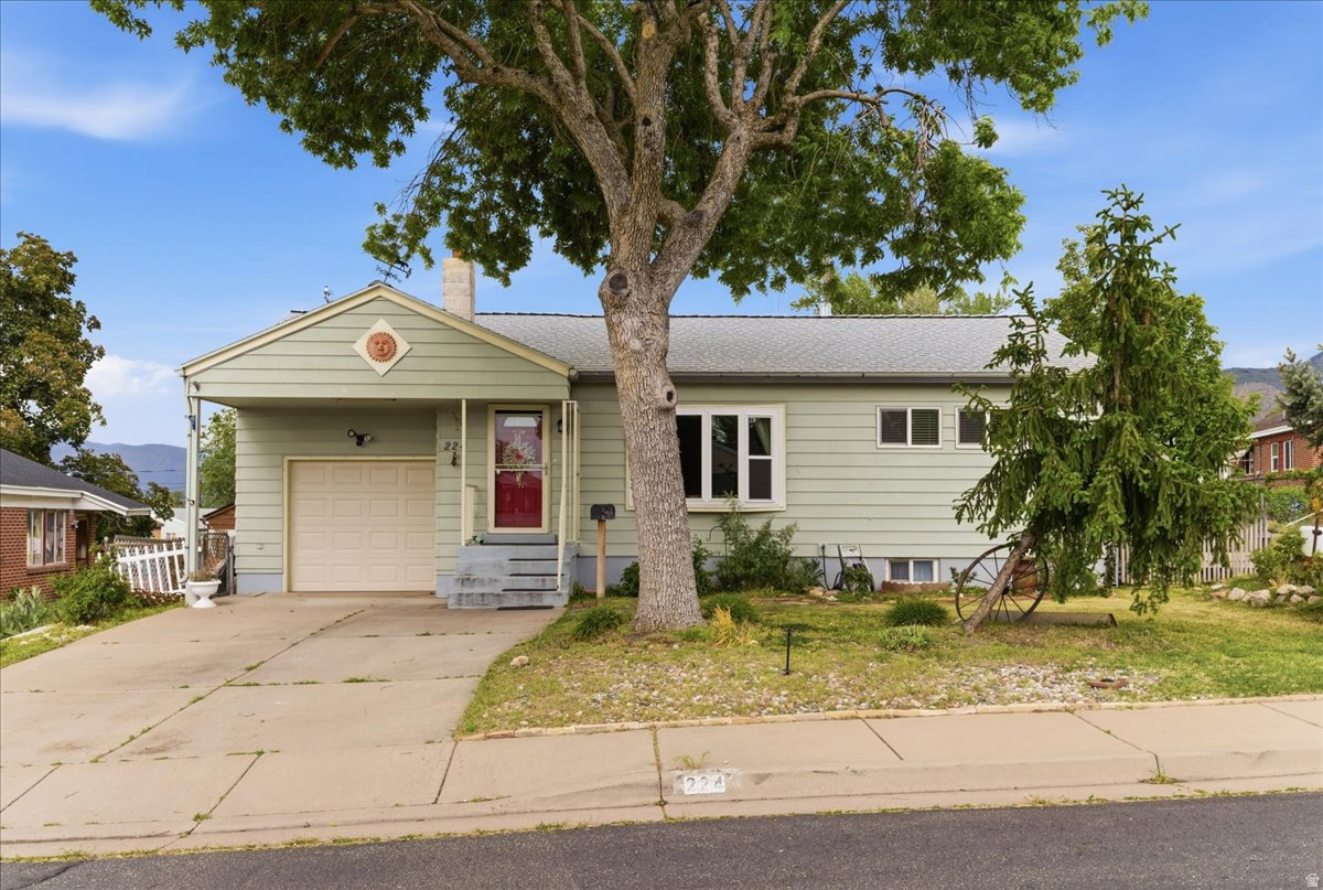 PRIDE IN OWNERSHIP! Bright and welcoming home located in a peaceful neighborhood with mountain views from both the kitchen and backyard. This home features charming original hardwood floors, updated windows, modern plumbing, and a beautifully updated kitchen (2019) with an Amish standalone pantry. Water heater replaced approximately two years ago. Carpet is located only on the stairs for easy maintenance throughout the rest of the home.  The main level offers 2 spacious bedrooms and a light-filled living room with a bay window. The basement includes a cozy family room and a private primary suite featuring a walk-in closet, updated shower, jacuzzi tub, and potential for a second kitchen. Enjoy the backyard patio, perfect for entertaining and outdoor gatherings. Move-in ready and conveniently located near local amenities, schools, and commuter access.