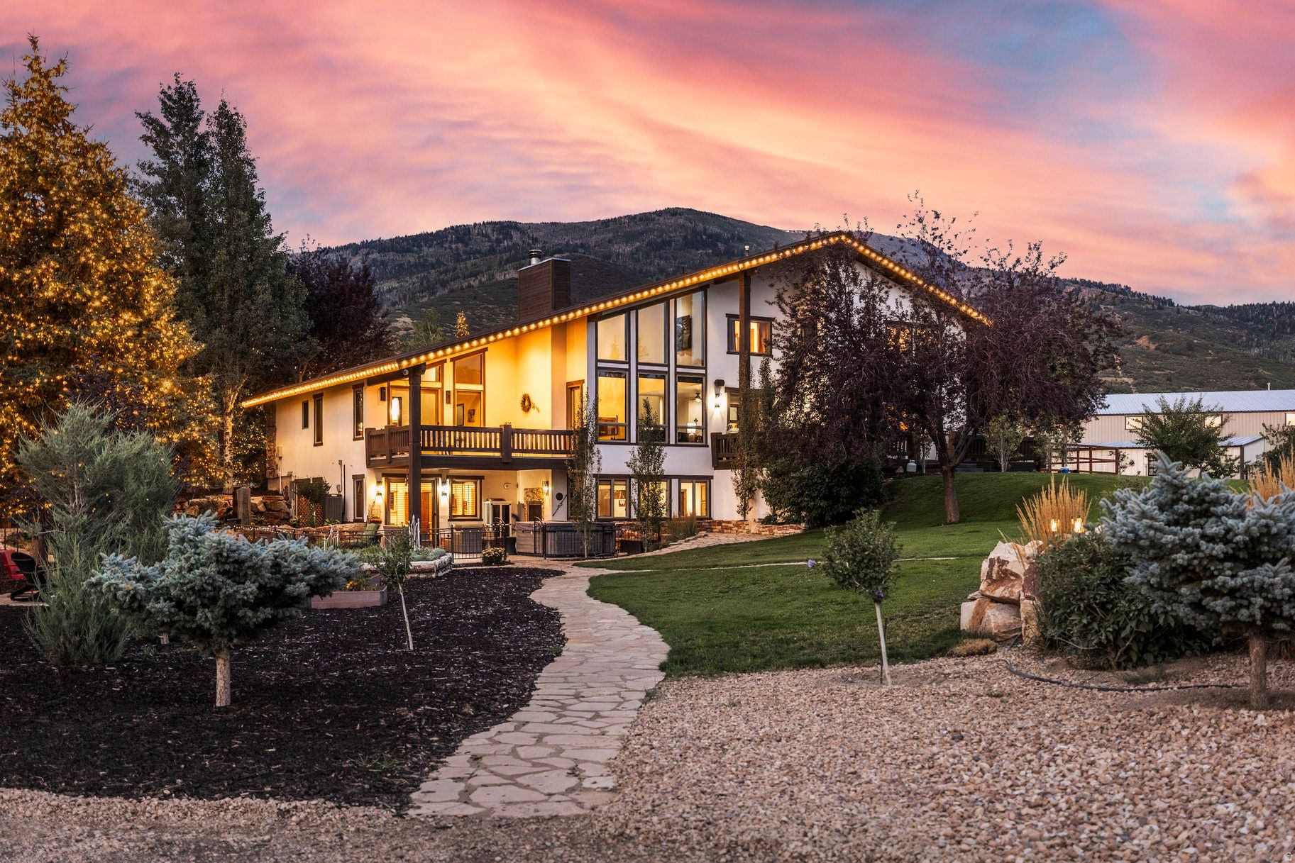 Red Arrow Ranch offers a rare opportunity to experience ranch living at its finest, where world-class equestrian infrastructure meets the warmth of a true multi- generational gathering place. Set in the heart of the Kamas Valley, the property was thoughtfully designed for those who value open land, time outdoors, and a place to gather with family and friends for generations to come. At its core is a fully realized equestrian environment featuring a refined European-style barn, a newly constructed Heritage barn, an Olympic-scale indoor arena, premier outdoor arena, covered round pen, and an IMTCA-certified trail course. Ample paddocks provide flexibility for competitors, hobbyists, and breeders alike. The main residence offers inviting gathering spaces with mountain views, while apartments above both barns allow comfortable accommodations for extended family, guests, or staff - creating a true ranch compound. Life at Red Arrow Ranch extends beyond the arena with irrigated pastures, a European greenhouse, custom chicken coop, playground, and space to roam in every direction. Supported by extensive water holdings and infrastructure across three parcels, the ranch offers privacy, permanence, and capability in one exceptional Kamas Valley setting.
