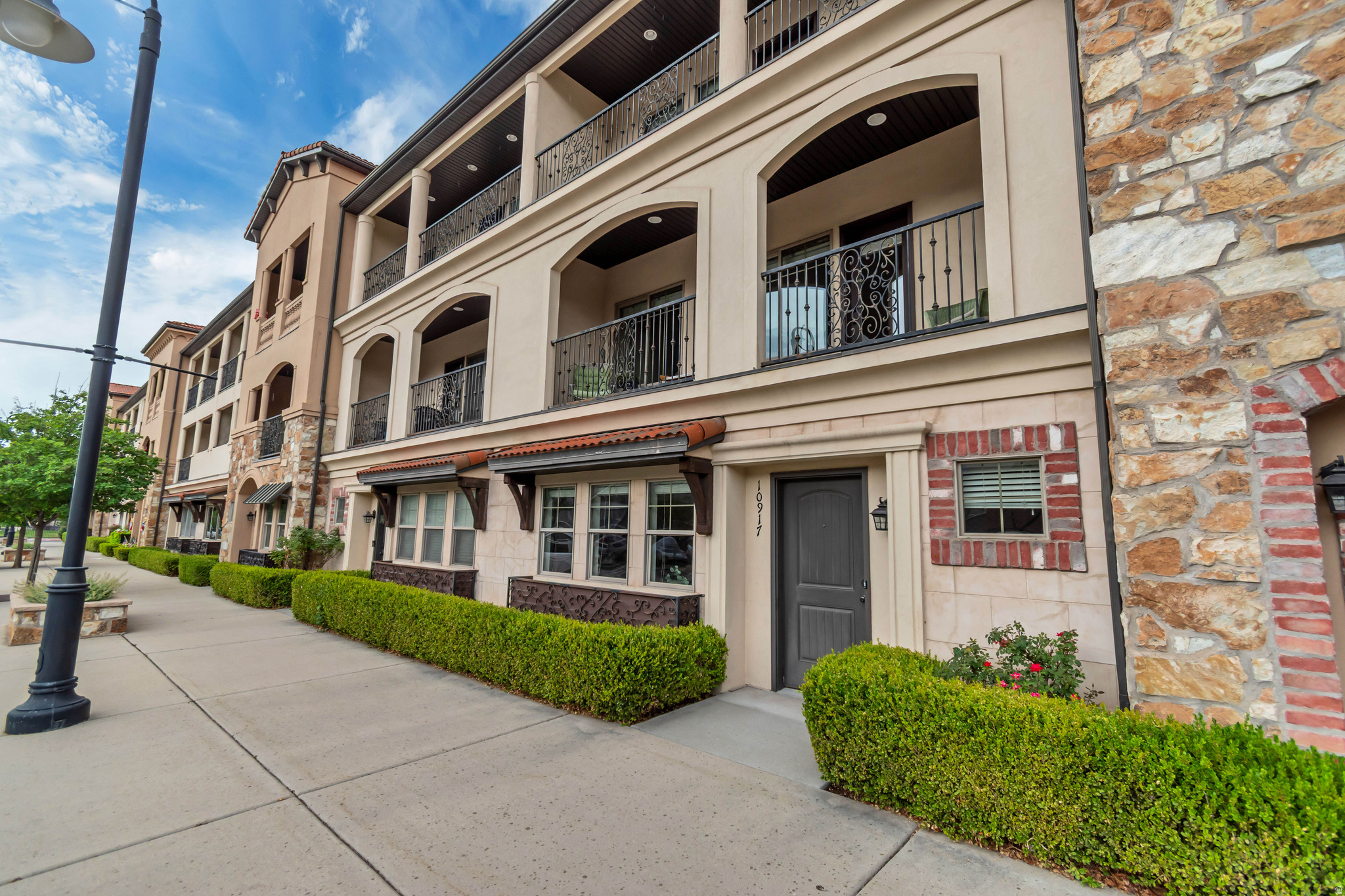 This beautifully maintained east-facing townhome offers spectacular mountain views from both the second- and third-floor balconies. Residents enjoy access to exceptional community amenities, including a swimming pool, hot tub, and clubhouse.  The home features an attached two-car garage, with additional convenient parking located directly in front of the townhome. The welcoming community also hosts occasional HOA-sponsored social events, creating a friendly neighborhood atmosphere.  Inside, the home is in excellent condition and has been thoughtfully updated with new carpet in the bedrooms and beautiful bamboo flooring throughout the kitchen, family room, and den. The purchase includes a like-new Whirlpool front-loading washer and dryer on raised pedestals for added convenience, as well as a 60-inch television in the family room.  The interior paint is in excellent condition throughout, making this home truly move-in ready.
