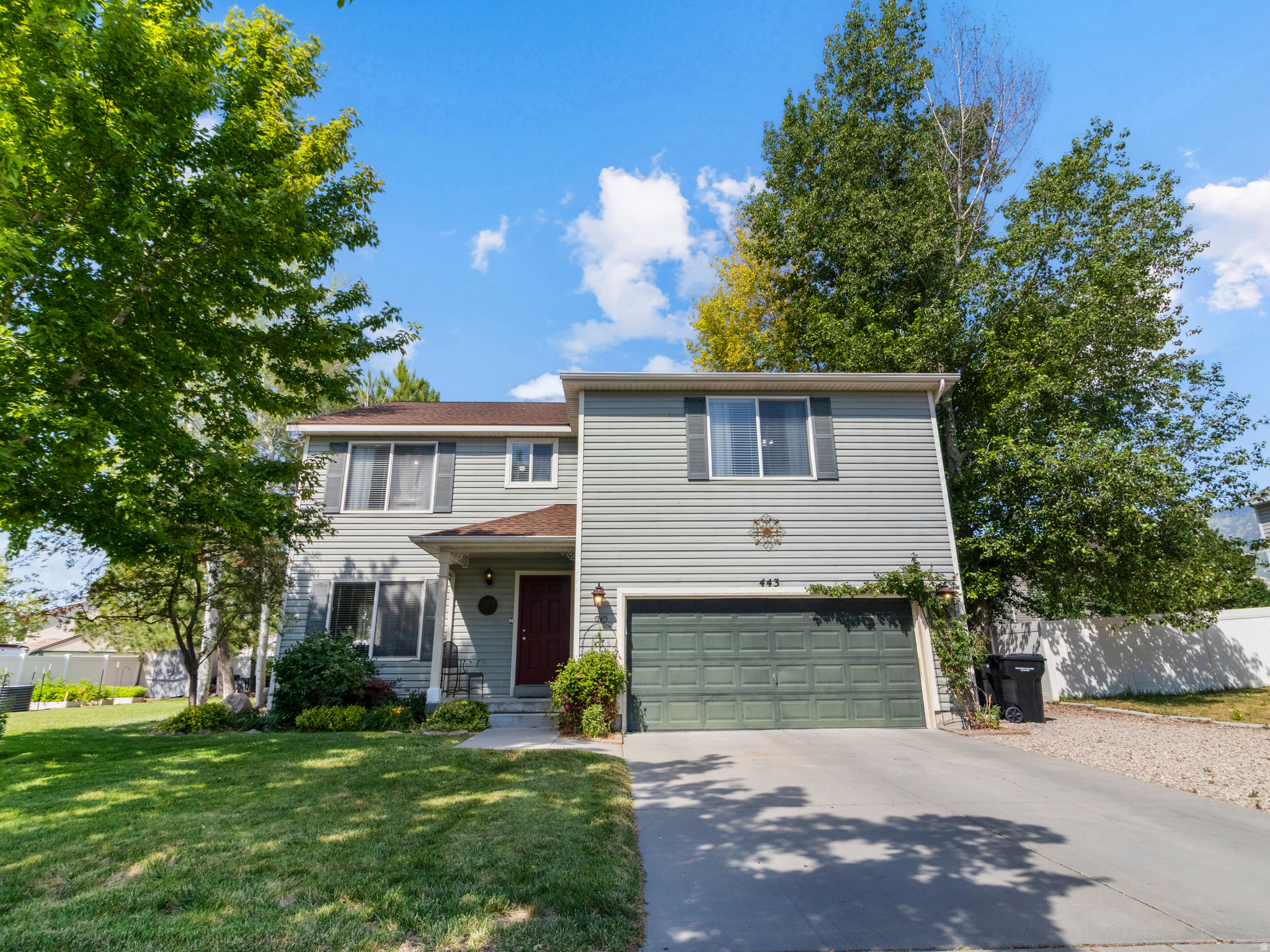 Beautifully updated Stansbury Park home in a prime location near parks, shopping, schools, medical services, and the lake. Multiple living areas, and a spacious kitchen, this home offers comfort and versatility. Recent improvements include a newer roof, HVAC, appliances, and remodeled bathrooms. The beautifully landscaped yard is a standout, with mature trees, raised garden beds, drip irrigation, and a private pergola-covered patio perfect for relaxing or entertaining.