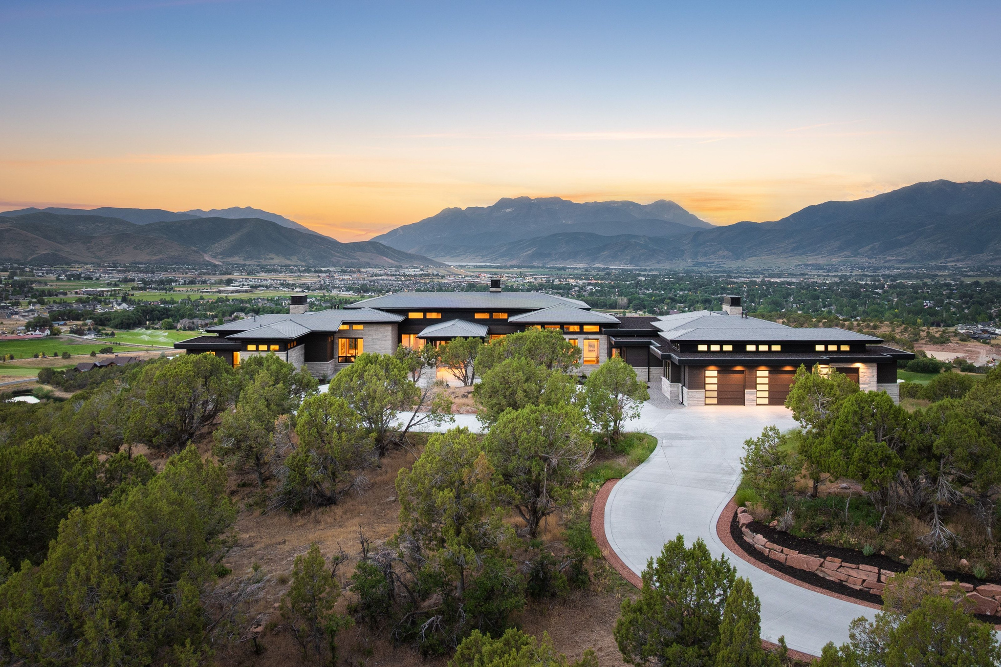 Introducing the most significant private estate ever offered in Red Ledges. This extraordinary $15.9 million legacy residence presents a once-in-a-generation opportunity to own what is widely considered the community's premier homesite. Personally selected by one of the founders and owners of Red Ledges before the community was established, this remarkable 3.78-acre estate commands breathtaking 360-degree views of Deer Valley Resort, the Uinta Mountains, Mt. Timpanogos, Deer Creek Reservoir, and multiple fairways of the Jack Nicklaus Signature Golf Course. Ideally located near the heart of the community, the estate offers convenient access to the Clubhouse, golf, dining, fitness center, pools, tennis, pickleball, and the full collection of Red Ledges amenities while maintaining exceptional privacy. More than a home, it is the original vision of Red Ledges--a private mountain sanctuary that celebrates extraordinary scenery and an unparalleled lifestyle. Given today's development standards, available homesites, and construction timelines, a property of this scale, location, and significance simply cannot be duplicated. Designed by Kevin Price Designs with interiors by Alder & Tweed and furnishings curated by Kelly Posaki Design, every detail reflects timeless craftsmanship and refined luxury. Highlights include a dramatic floating white oak staircase, retractable walls of glass, a stunning 21-foot double-sided fireplace, handcrafted cabinetry, custom Hammerton lighting, radiant heated floors, and more than 5,400 square feet of covered outdoor living. The residence features six luxurious bedroom suites, dual private libraries, a walnut executive office, gourmet and catering kitchens, expansive gathering spaces, and the flexibility to create future amenities such as a golf simulator, wine cellar, wellness studio, or private cinema. This is more than an extraordinary home--it is one of the finest legacy estates in the Wasatch Back and a truly irreplaceable opportunity.