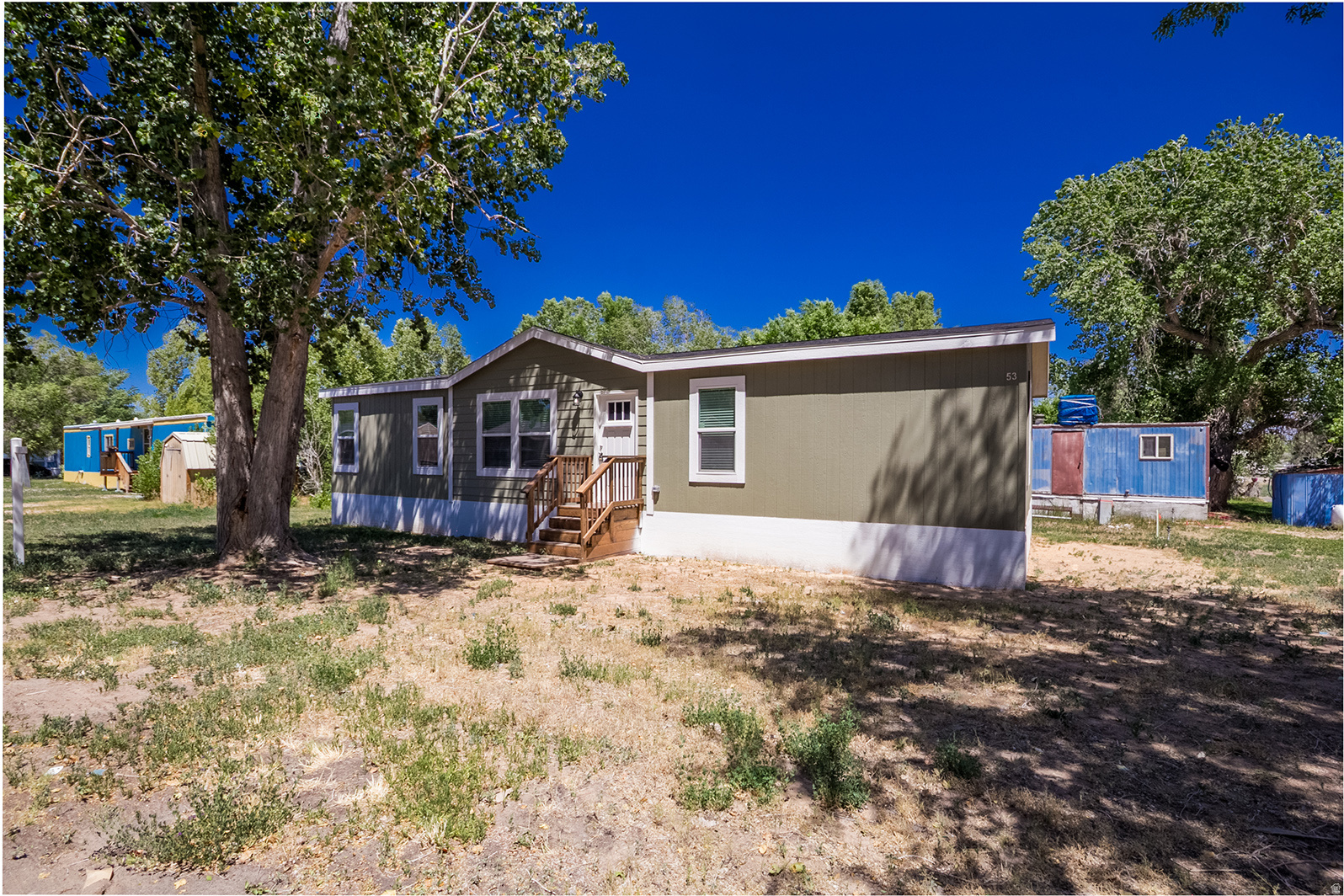 This brand-new home is just as beautiful on the inside as it is on the outside and is available in East Meadows Mobile Home Park, conveniently located in downtown Vernal, Utah. Offering 1,420 square feet of living space, this home features 4 bedrooms and 2 bathrooms, along with beautiful cabinetry, stylish flooring, and stainless-steel appliances. The bright white cabinetry creates a clean, modern feel throughout the home. The spacious primary suite includes a luxurious ensuite bathroom with double sinks, a walk-in closet, a large walk-in shower with a built-in seating area, and a private commode. Additional storage, upgraded lighting, and thoughtful design details make this home both functional and inviting.  Don't miss the opportunity to own this stunning, never-lived-in home in a desirable location close to shopping, dining, and local amenities.