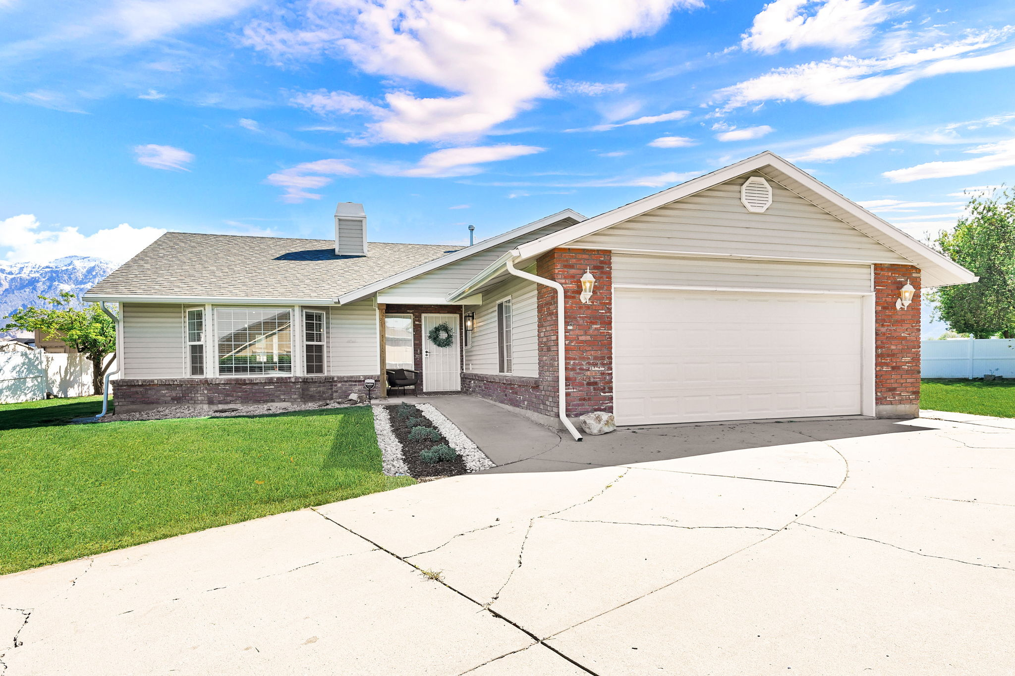 Welcome to this beautifully renovated 1,864-sqft gem, perfectly situated in a quiet and highly sought-after Farr West cul-de-sac. Every inch of this 3-bedroom, 2-bathroom home has been thoughtfully updated to provide a modern, move-in-ready experience. The heart of the home features a sleek, updated kitchen boasting brand-new cabinets and contemporary finishes. Throughout the house, you'll find fresh paint, new front windows that flood the space with natural light, and elegant raised ceilings that create an airy, expansive feel. Enjoy the modern comfort of the high-quality fireplace featuring an adjustable TV mount, perfect for cozy evenings. The primary suite serves as a true retreat, offering a large bedroom layout, private ensuite with double sinks and new vanity. Outside, the property sits on a large, private yard, offering endless possibilities for gardening or entertaining. With a roof that is only 10 years old and high-end upgrades throughout, this home combines peace of mind with sophisticated style. Schedule your visit today!