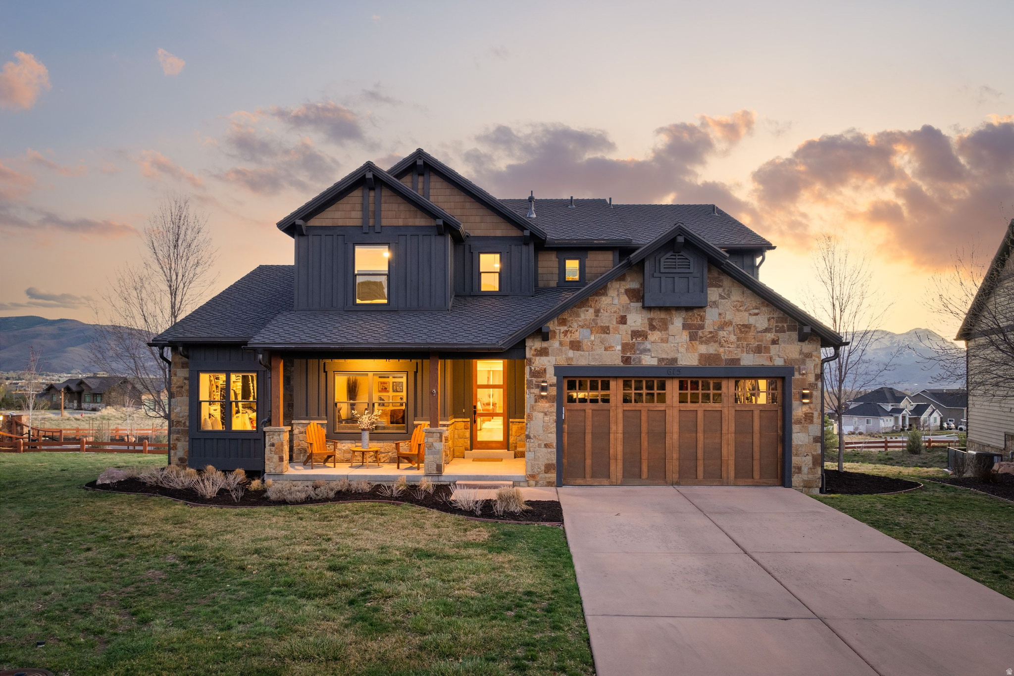 Located within the gated Red Ledges community near the new West Gate, this 4 bedroom, 4 bath home offers 3,572 square feet and a 2022 remodel that feels clean, current, and ready to enjoy.  The main level is designed for easy living, with a primary suite, open kitchen, dining, and living areas, plus an expanded office and mudroom. Upstairs, three additional bedrooms, updated baths, and a separate family room provide space for guests while maintaining a natural flow.  Views of Mount Timpanogos are direct and unobstructed, with sunsets that become part of the daily routine. The main level opens to an expanded deck, extending the living space outdoors.  The remodel brings a clean mountain modern feel. A full height custom stone fireplace with a reclaimed 200 year old wood mantel anchors the living room. The primary suite is fully updated with a new bath and expanded closet with washer and dryer. The kitchen features quartz countertops and backsplash, updated cabinetry, new appliances, and modern hardware. Additional improvements include wide plank wood flooring, new carpet, remodeled secondary baths, an oversized sliding door for natural light, and an extended deck with powder coated railings. The home also includes a new front door, full interior and exterior repaint, updated systems, and UV protection on key glass areas.  Located minutes from downtown Heber, Smith's grocery store, and about 12 minutes to Deer Valley East Village, the home offers a strong balance of privacy and convenience. Ownership includes required club membership within Red Ledges, offering golf, tennis, pickleball, equestrian facilities, fitness, dining, and ongoing investment in amenities.  Red Ledges stands out as one of the best value plays among Utah's private golf communities, with more owners choosing to live here full time.