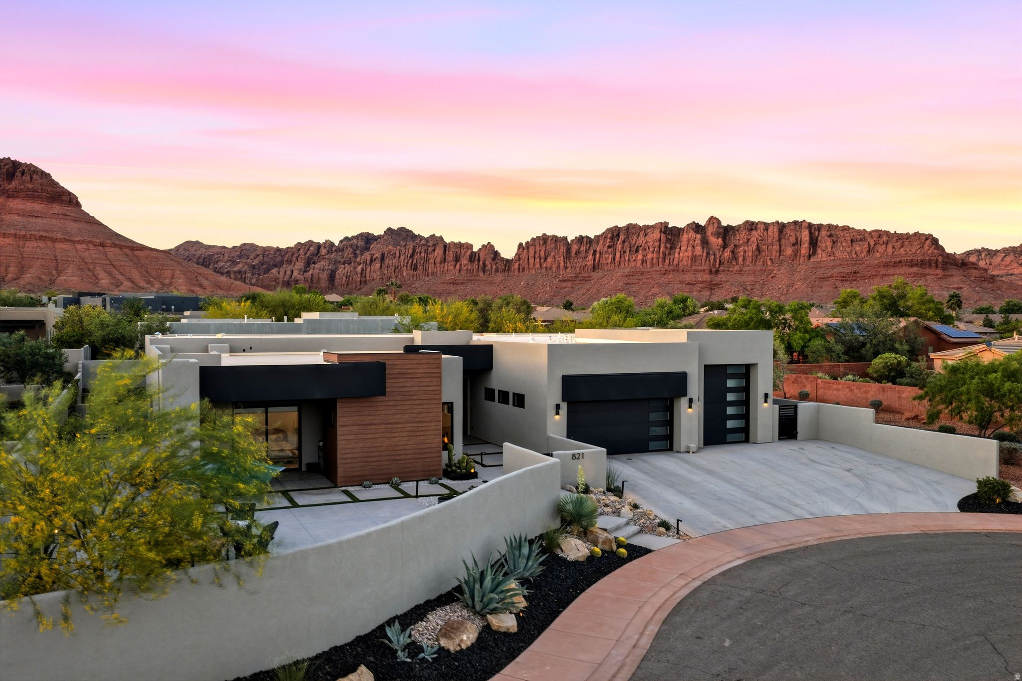 Escape to your private haven in the exclusive gated community of The Palisades at Snow Canyon, where breathtaking red rock views and proximity to Snow Canyon State Park create the ultimate luxury retreat. This stunning estate boasts an elegant interior, featuring 24 x 48 inch porcelain tile floors and a dream kitchen, equipped with Thermador appliances, double ovens (including a steam oven), custom cabinets, and a spacious walk-in Butler's pantry. The large island is perfect for entertaining, while the glass office provides a serene space for work or study. The home's four bedrooms, including a heavenly master suite with modern shower and large walk-in closet, offer ample space for relaxation. Who wouldn't want to wake up in this house when you have a room with a view as well as total privacy.  Two ensuite guest rooms make this home the perfect design, with a large private courtyard just outside one guest suite. A flexible additional bedroom can serve as a Casita or flex room, catering to every need. Outside, the timeless pool with hot tub, fountain, and outdoor kitchen creates a haven for alfresco living, while the RV garage is a rare find for adventure enthusiasts. Central VAC ensures comfort throughout the home. With its prime location, this incredible Ivins estate offers the best of luxury living, from gated community amenities to easy access to hiking and biking trails, Tuacahn amphitheater, nearby world class golf courses, and more!