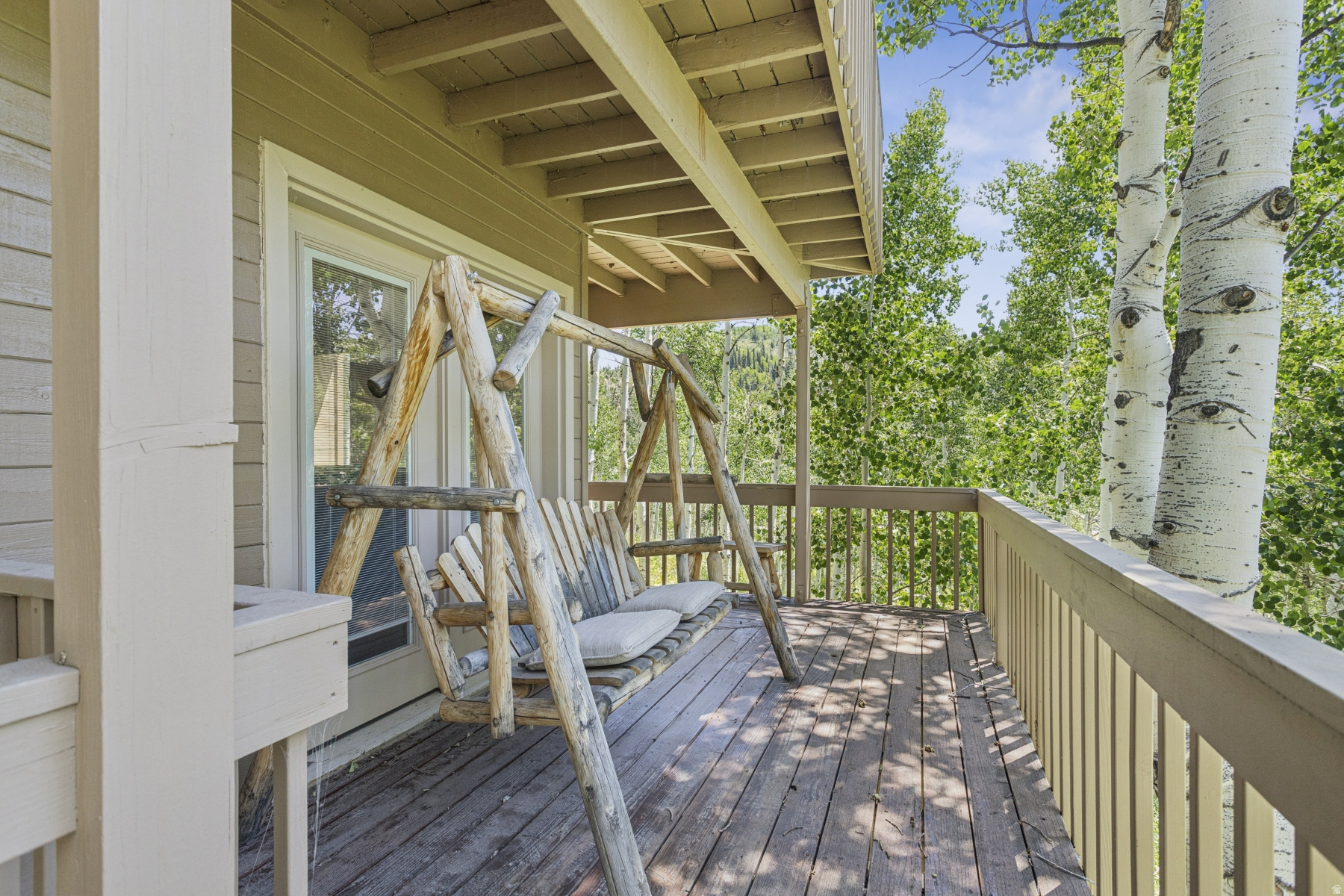 Imagine spending time in this thoroughly updated cabin among  these cool leafy aspens.  Upscale remodel offers an inviting primary suite and a fun bunk room, both with their own private balconies.  Kitchen opens to spacious dining area. Lower level garage has convenient wash sink and bathroom as well as huge storage area.  Cabin is sold turn key, fully furnished.  Flat driveway offers plenty of room for parking.  Cabin is just a short distance from the paved part of Blue Spruce.  Blue Spruce is on the main plow route for easy winter access.
